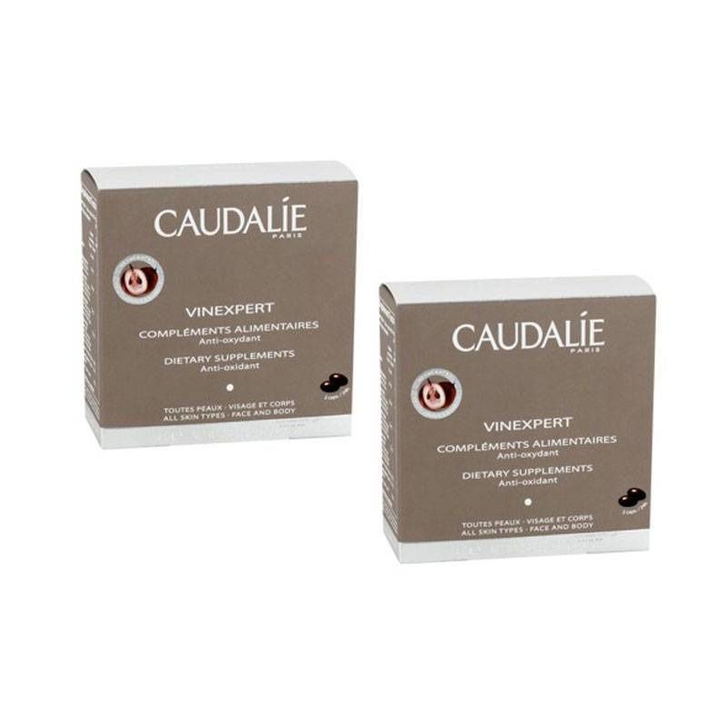 Deux boîtes Caudalie Vinexpert. Inscription: Vinexpert Compléments Alimentaires, Anti-oxydant, Dietary Supplements. Pour tous types de peaux.