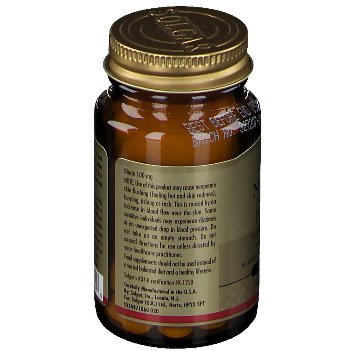 Achterkant bruine glazen fles. Etiket met tekst over niacine 100 mg. KOF-certificering. Fabrikantinformatie.