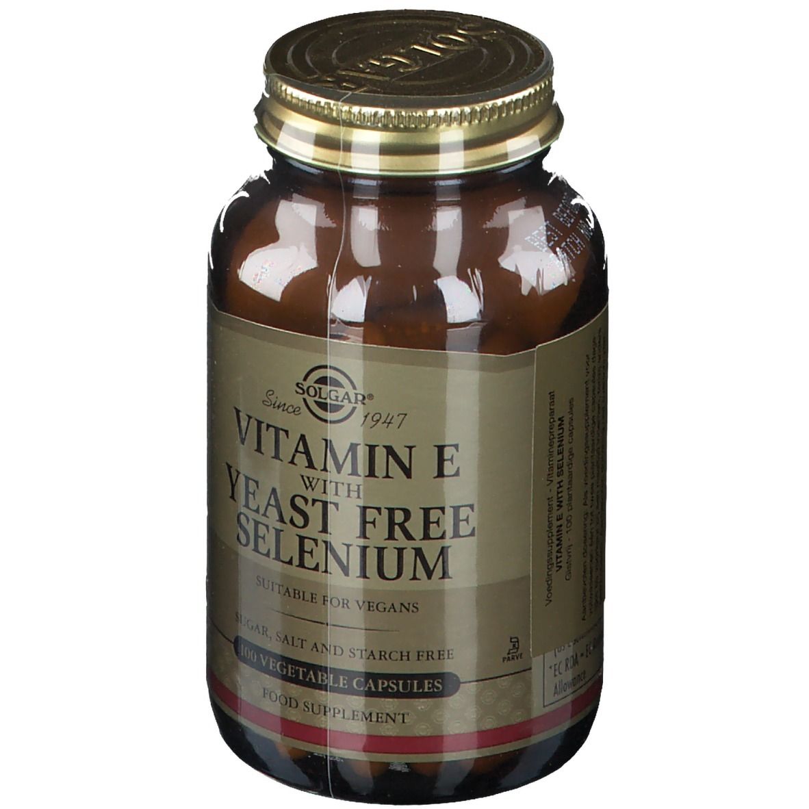 Flacon en verre brun avec couvercle doré. Inscription : Vitamine E avec sélénium sans levure. Convient aux végétaliens. 100 gélules.