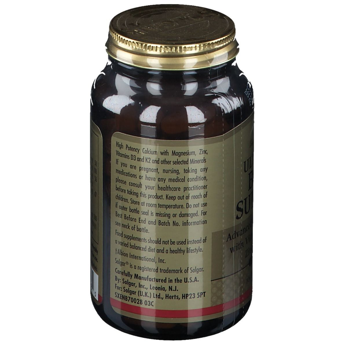 Rückseite einer braunen Glasflasche mit goldfarbenem Deckel. Etikett mit Produktinformationen und Inhaltsstoffen. Enthält Calcium, Magnesium, Zink.