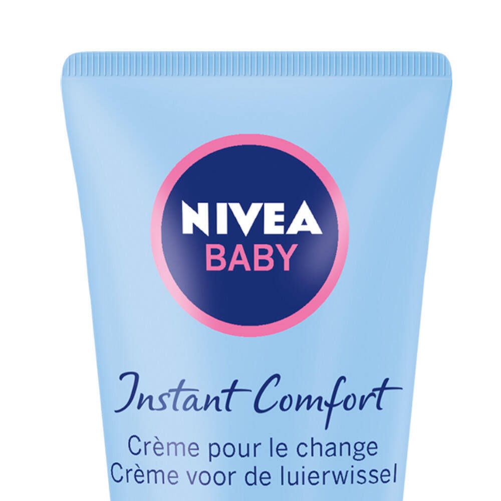 Close-up van de tube. NIVEA BABY logo in een cirkel. Tekst: Instant Comfort, Crème pour le change.