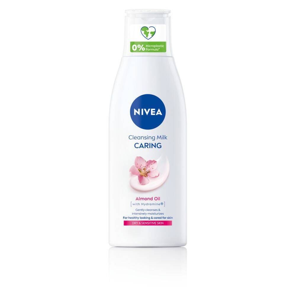 Flacon blanc NIVEA. Bouchon bleu, logo et informations produit. Illustration de fleur rose. Pour peaux sèches.