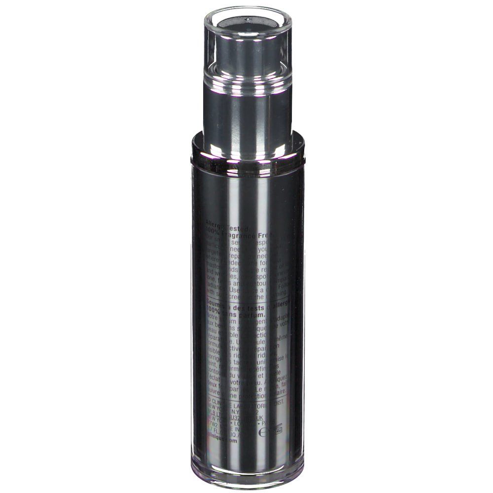 Flacon cylindrique argenté avec bouchon transparent et pompe. Texte sur le flacon.