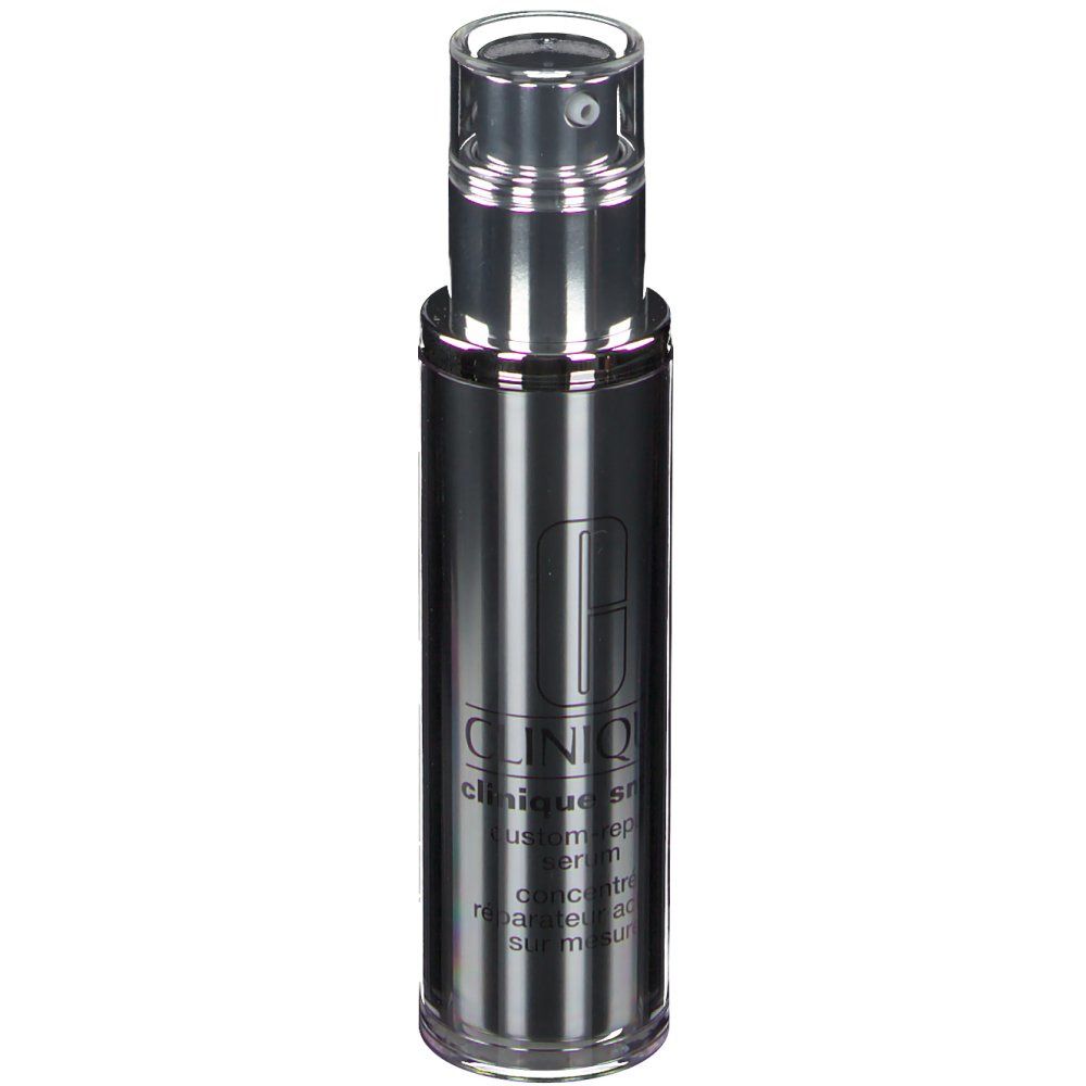 Flacon cylindrique argenté avec bouchon transparent et pompe. Inscription CLINIQUE smart Custom-Repair Serum.
