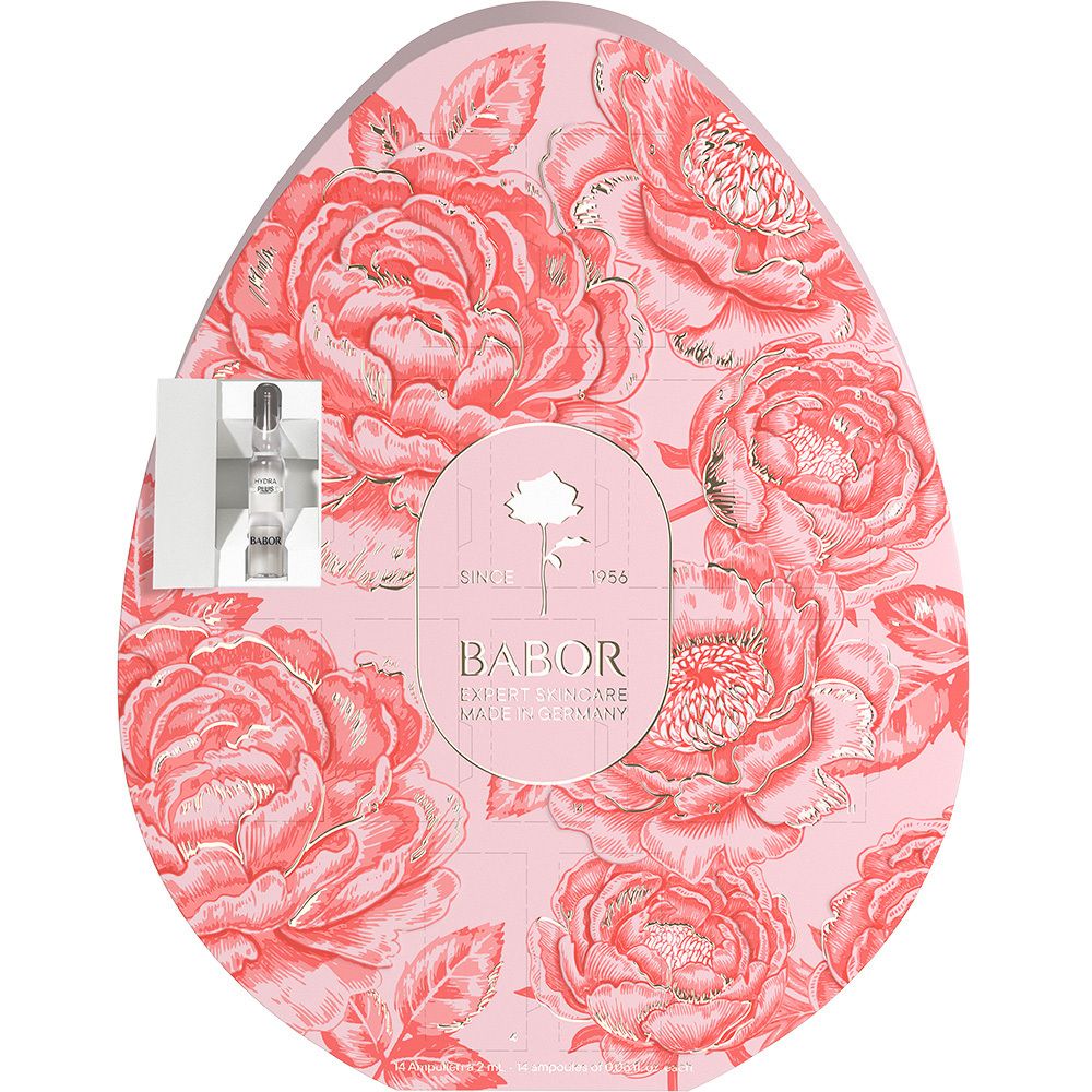 Babor Das Osterei: Ei-förmige Verpackung mit Blumenmuster, Babor Logo und einer Ampulle.