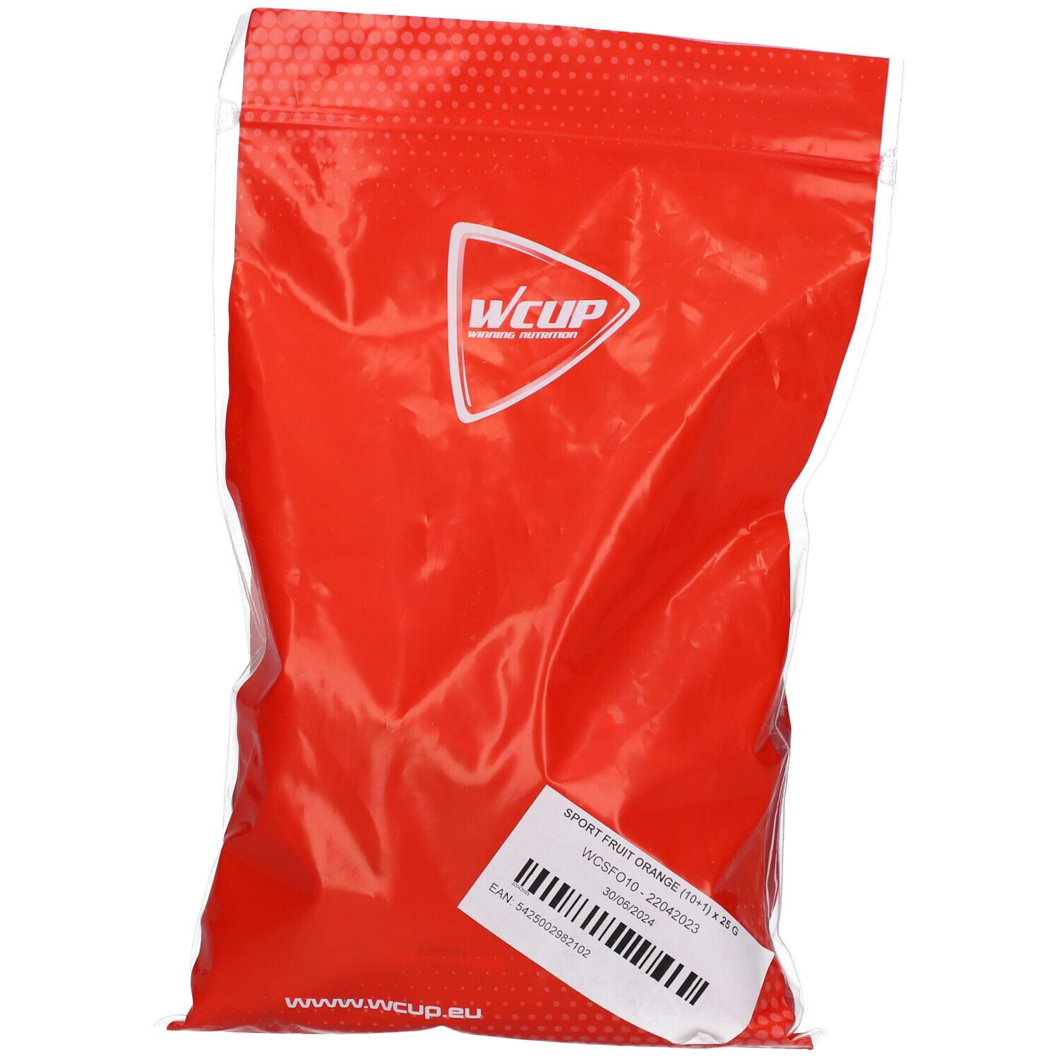Rode, transparante verpakking met Wcup-logo. Sticker met productinformatie. Tekst: Sport Fruit Orange (10 x 25 g).