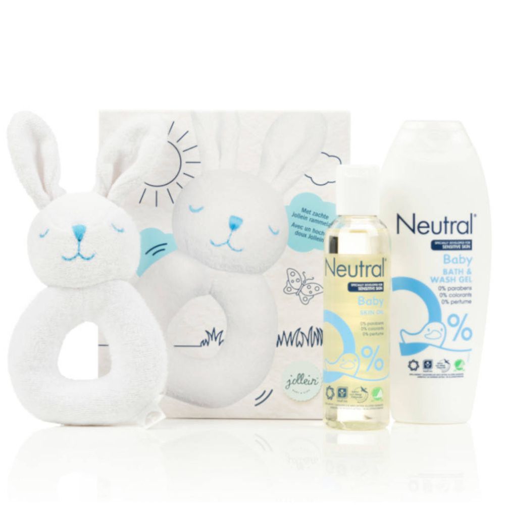 Coffret cadeau bébé avec gel lavant, huile et hochet lapin. Emballage avec soleil et lapin.