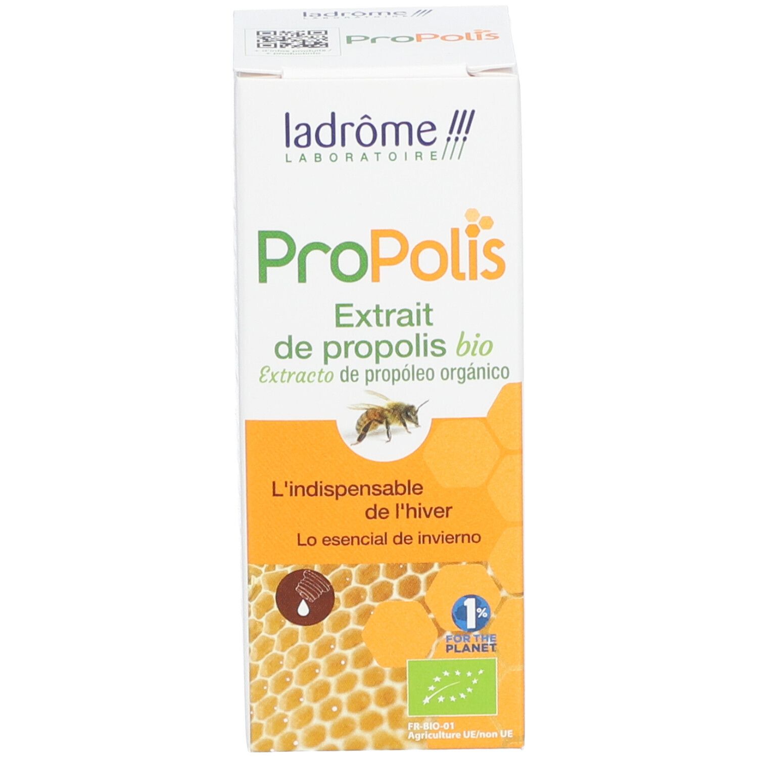 Doos met productnaam en logo. Een bij en een honingraatpatroon afgebeeld.