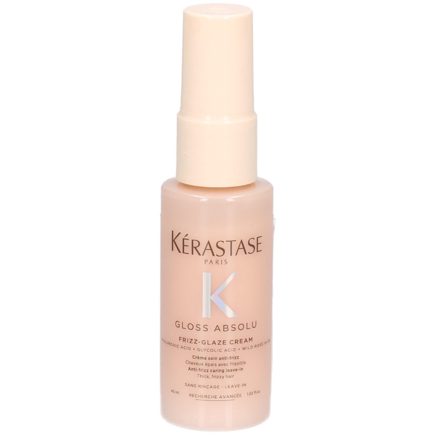Kérastase Gloss Absolu Frizz-Glaze Cream Mini in einem hellrosa Pumpspender, leicht schräg.