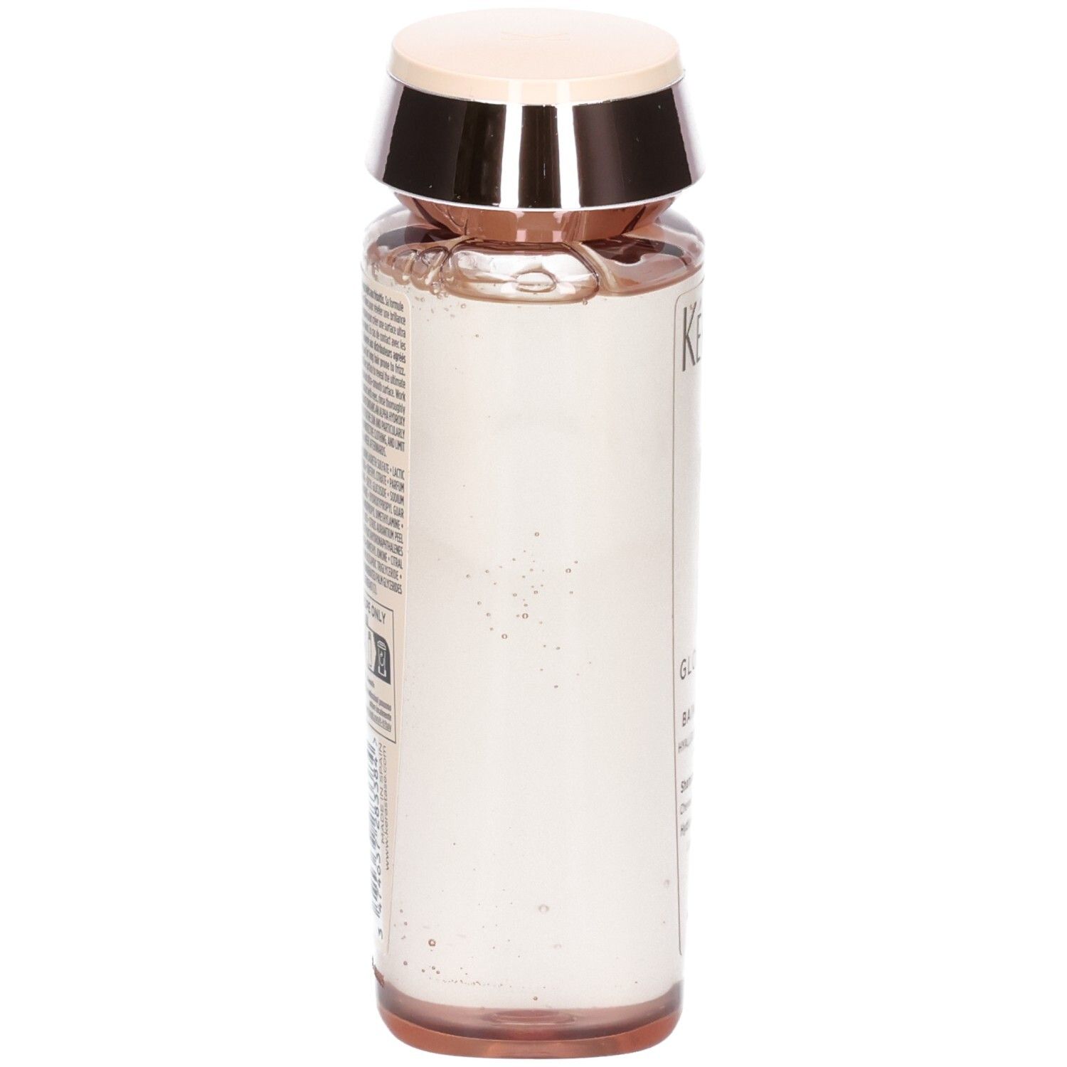 Kérastase Gloss Absolu Hydra-Glaze Shampoo. Seitenansicht der transparenten Flasche mit rosa Inhalt.