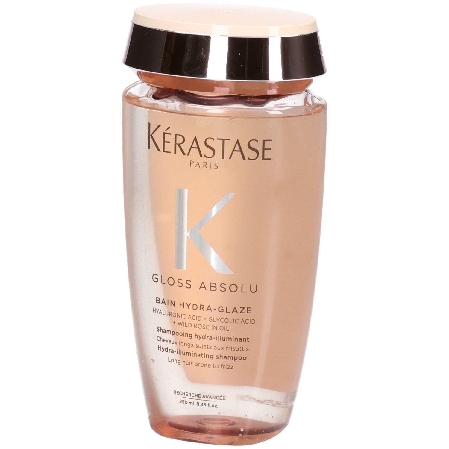Kérastase Gloss Absolu Hydra-Glaze Shampoo. Frontansicht der transparenten Flasche mit rosa Inhalt.