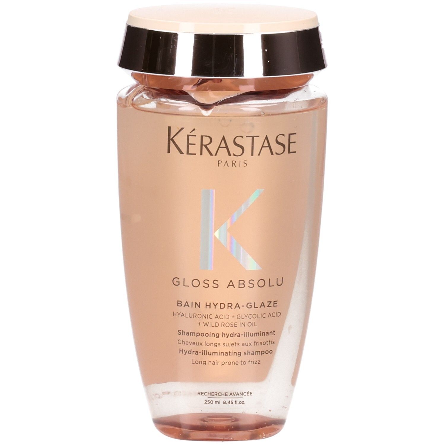 Kérastase Gloss Absolu Hydra-Glaze Shampoo. Transparente Flasche mit rosa Inhalt und goldfarbenem Deckel.