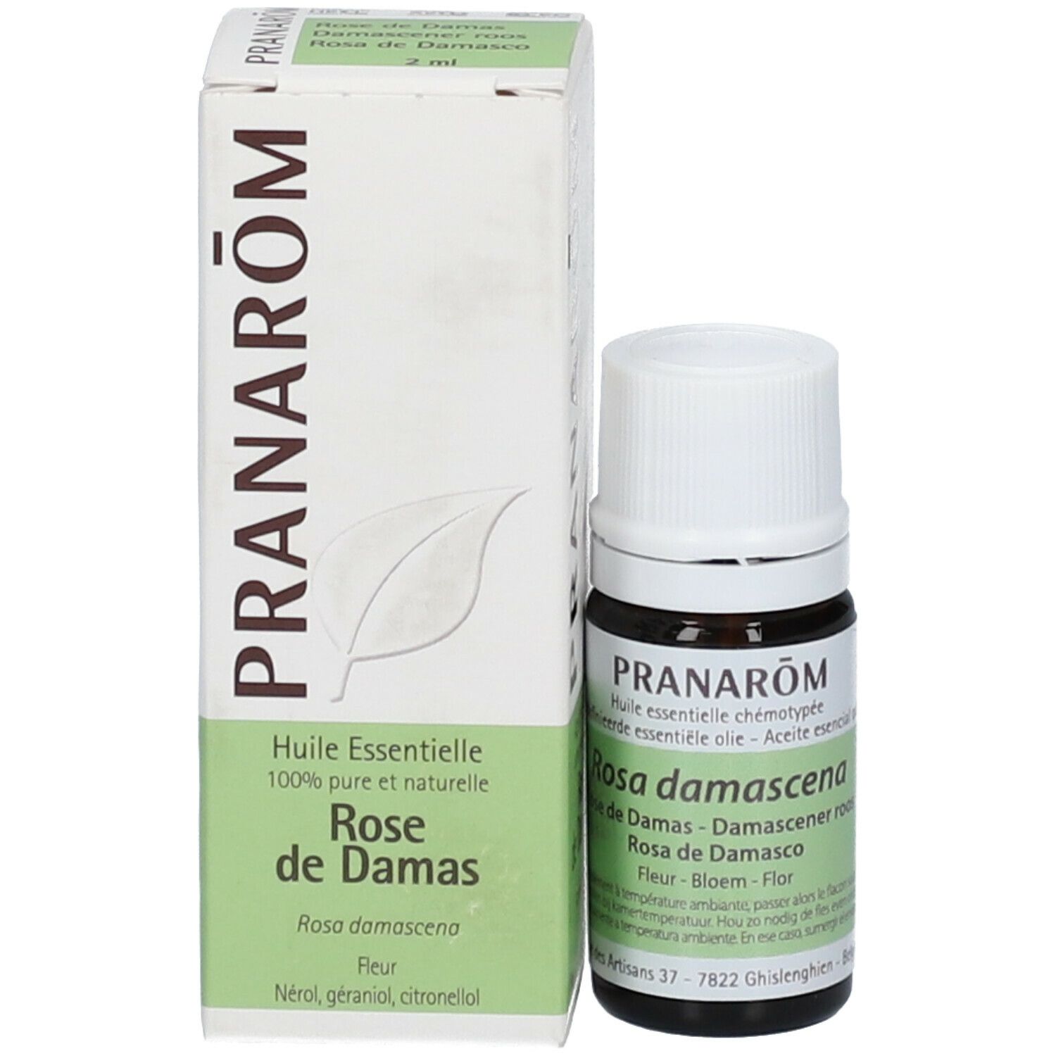 Flacon en verre brun avec bouchon blanc et emballage. Emballage avec texte: PRANAROM, Rosa de Damas. Texte vert sur fond blanc.