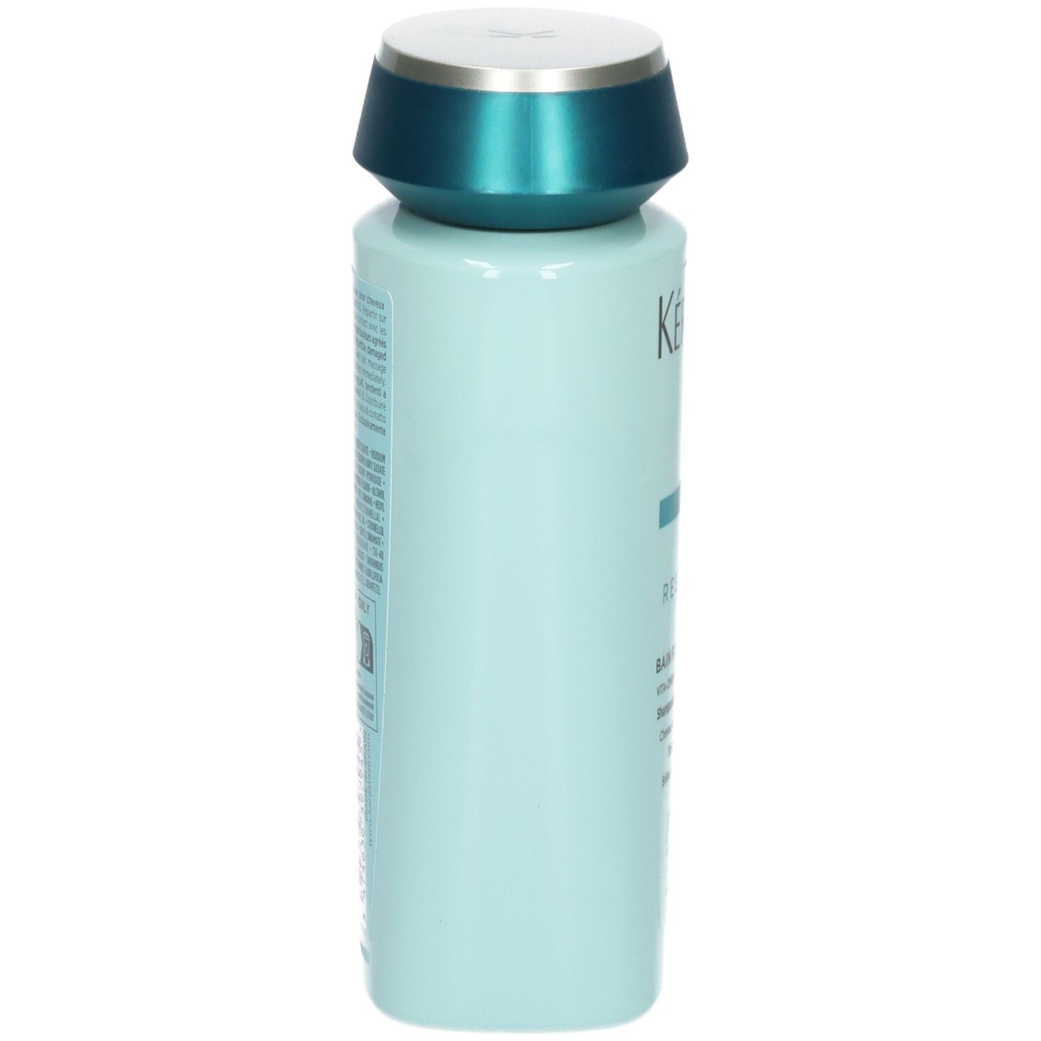 Seitenansicht der hellblauen Kérastase Shampoo-Flasche mit türkisfarbenem Deckel.