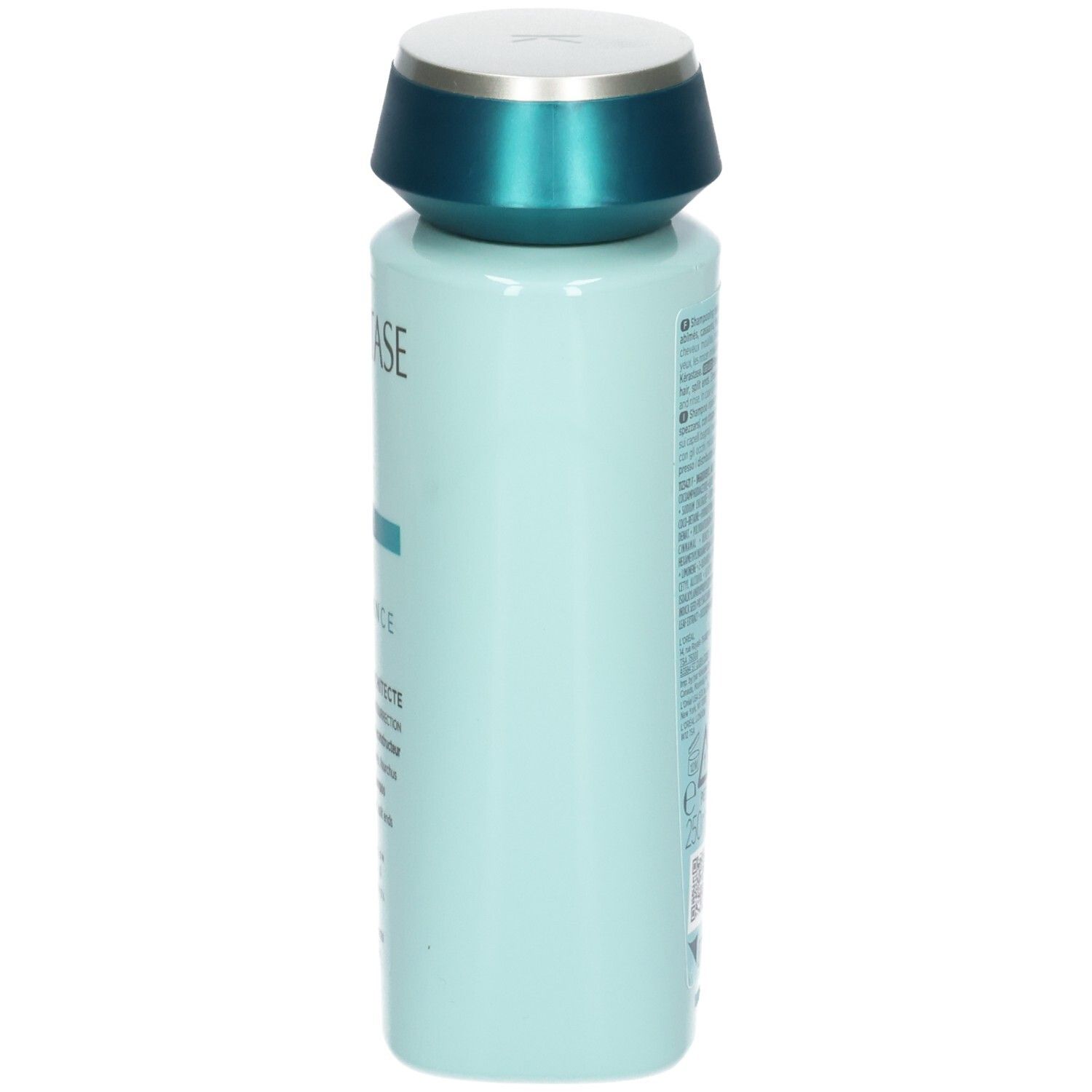 Seitenansicht der hellblauen Kérastase Shampoo-Flasche mit türkisfarbenem Deckel.