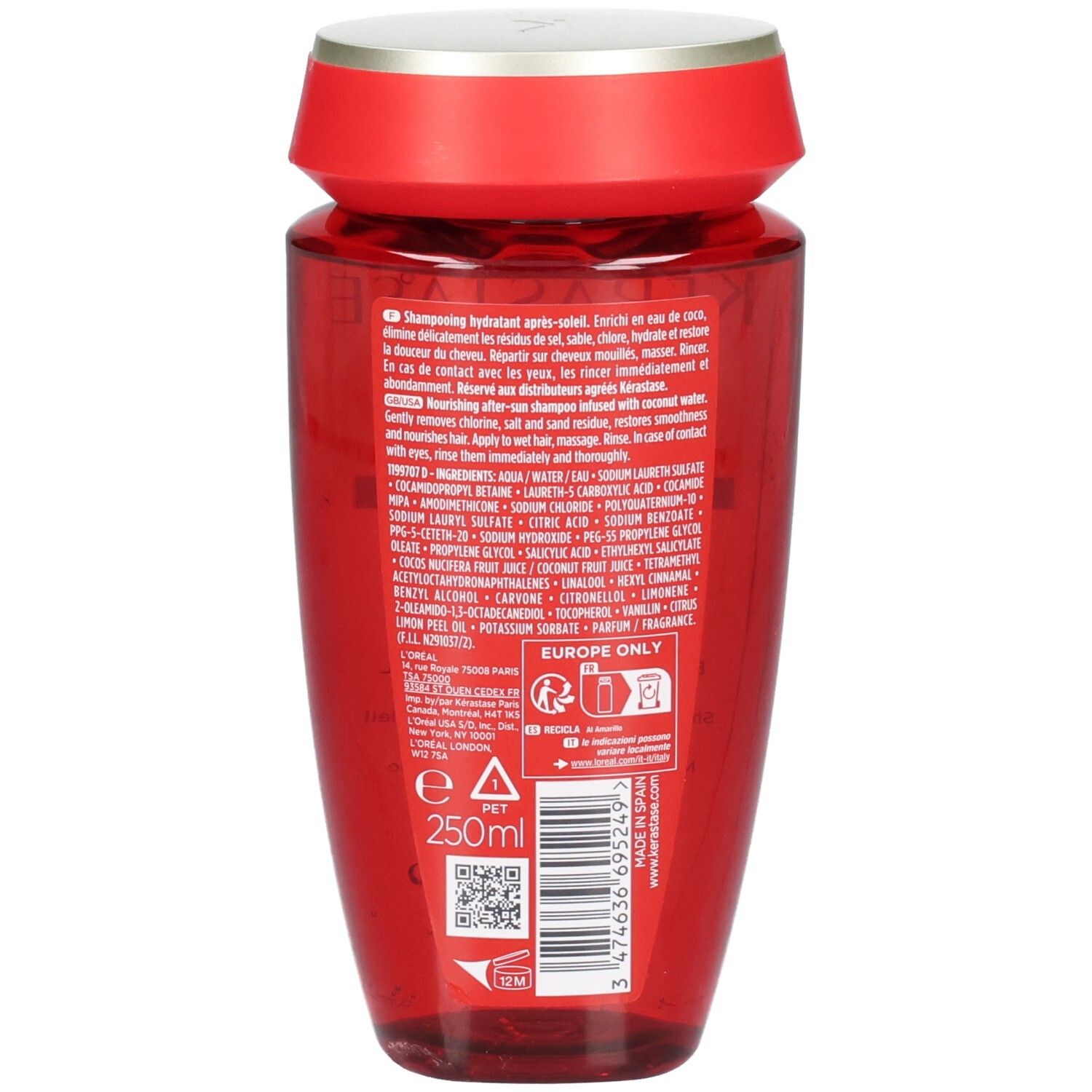 Rückseite einer roten Kérastase Flasche mit silbernem Deckel. Enthält Inhaltsstoffangaben und 250ml.
