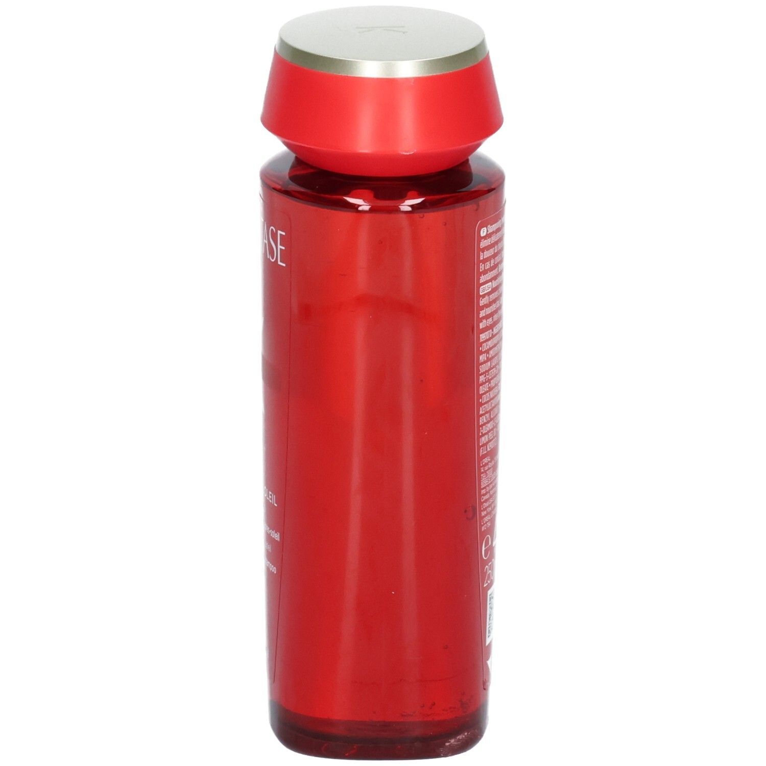 Rote Kérastase Flasche mit silbernem Deckel, Seitenansicht. K Soleil Bain Après-Soleil Shampoo.