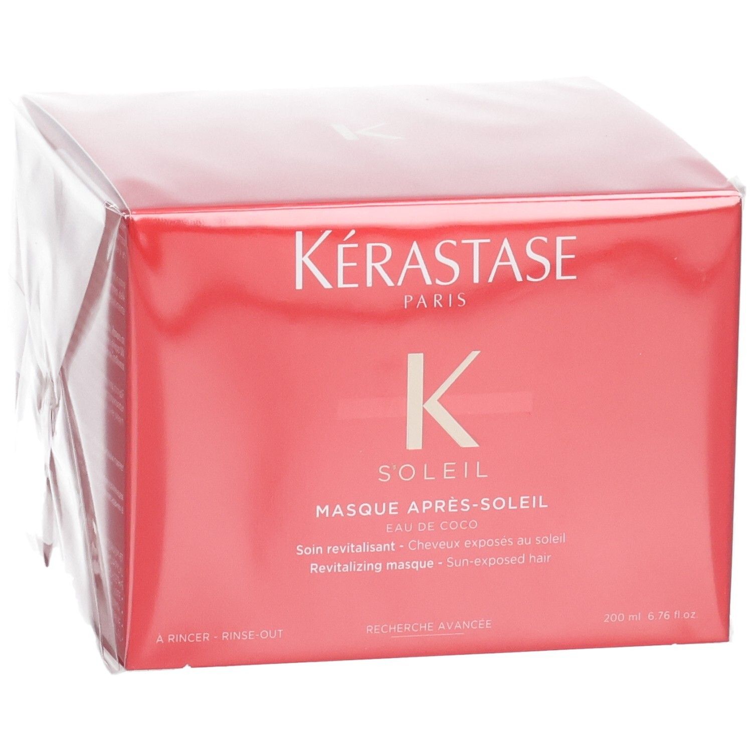 Kérastase Soleil Après-Soleil revitalisierende Haarkur in roter Verpackung, leicht schräg von vorne.