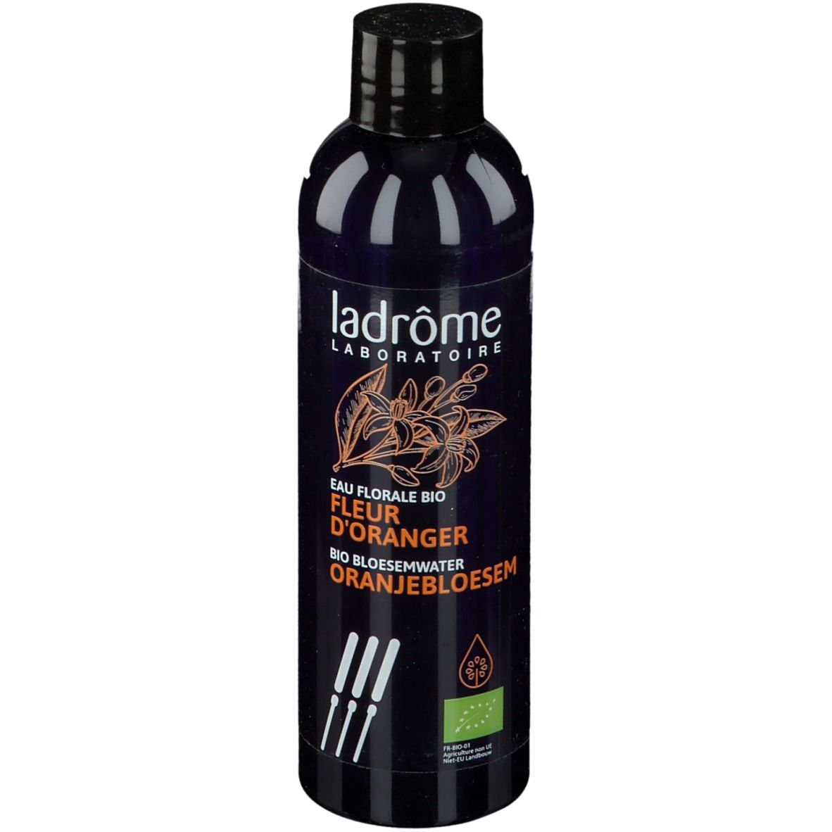 Donkerblauwe fles met zwarte dop. Opschrift: Ladrôme Laboratoire, Eau Florale Bio Fleur D'Oranger, Oranjebloesem.