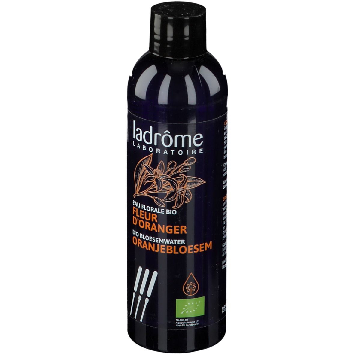 Donkerblauwe fles met zwarte dop. Opschrift: Ladrôme Laboratoire, Eau Florale Bio Fleur D'Oranger, Oranjebloesem.