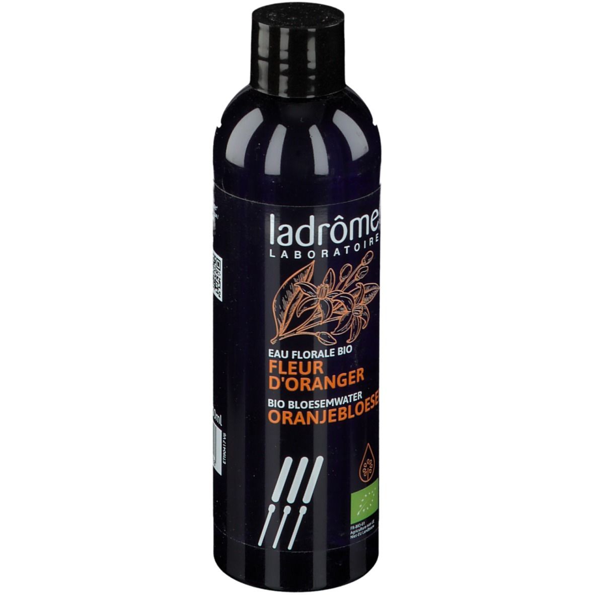 Donkerblauwe fles met zwarte dop. Opschrift: Ladrôme Laboratoire, Eau Florale Bio Fleur D'Oranger, Oranjebloesem.