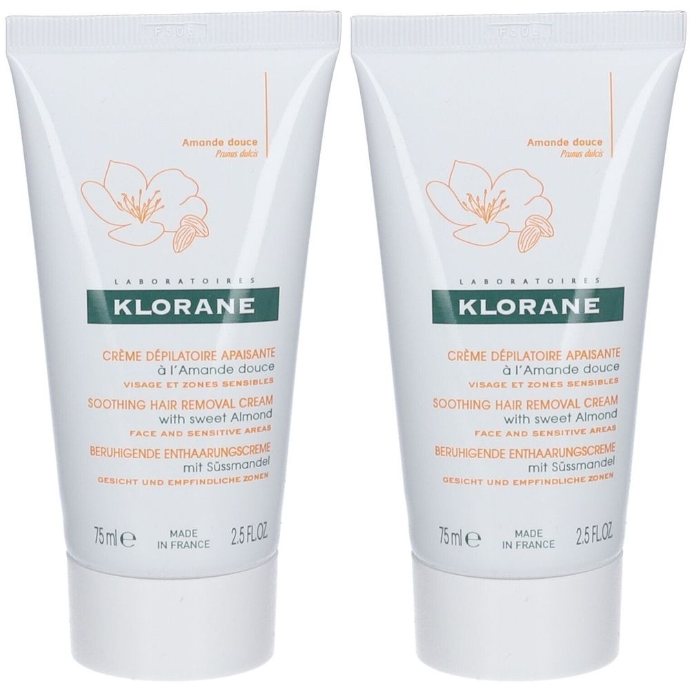 Zwei Tuben KLORANE Enthaarungscreme. Weiße Tuben mit grüner Schrift und Mandelblüten-Illustration. Text: Crème dépilatoire apaisante.