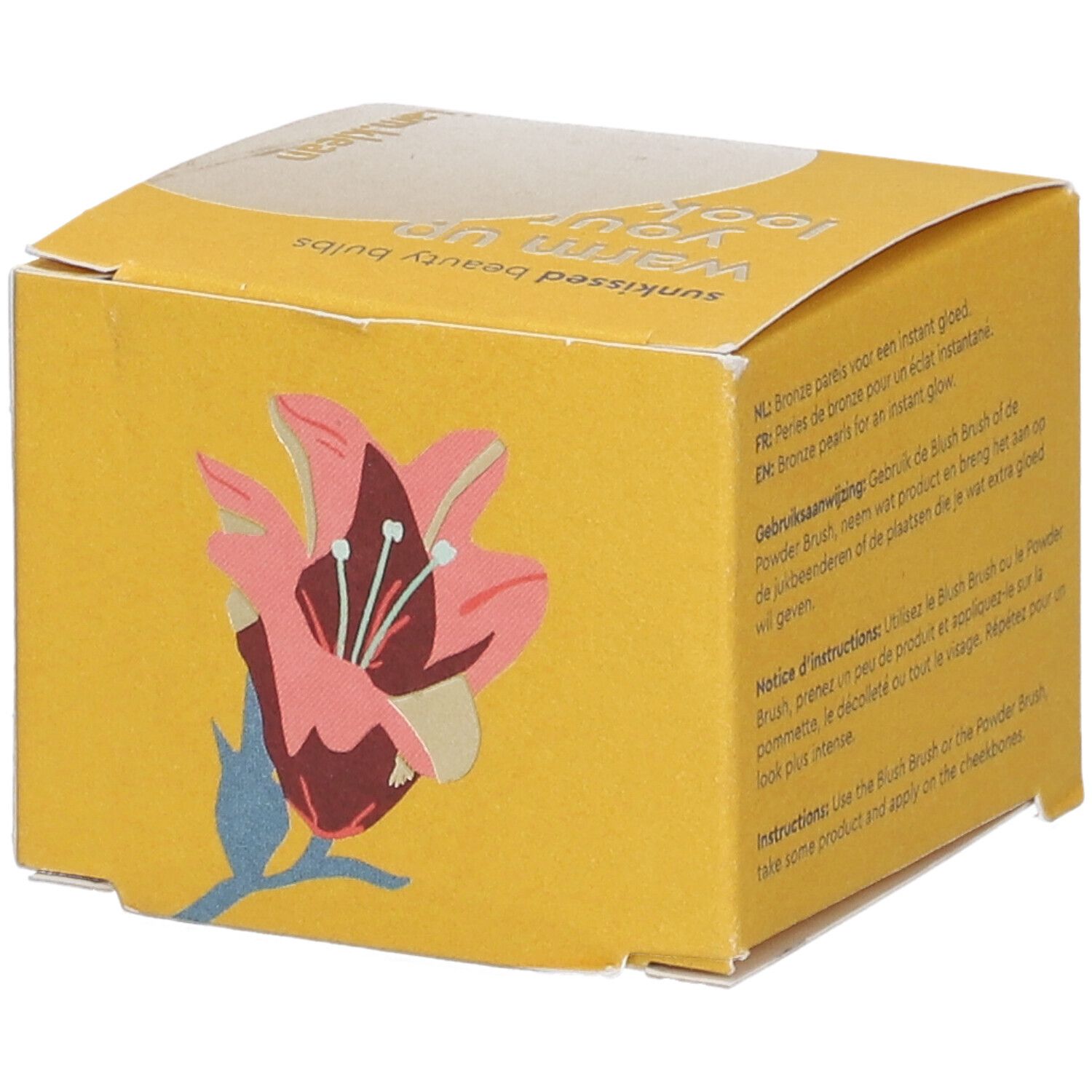 Gelbe Produktverpackung mit Lilien-Illustration und Text in mehreren Sprachen.