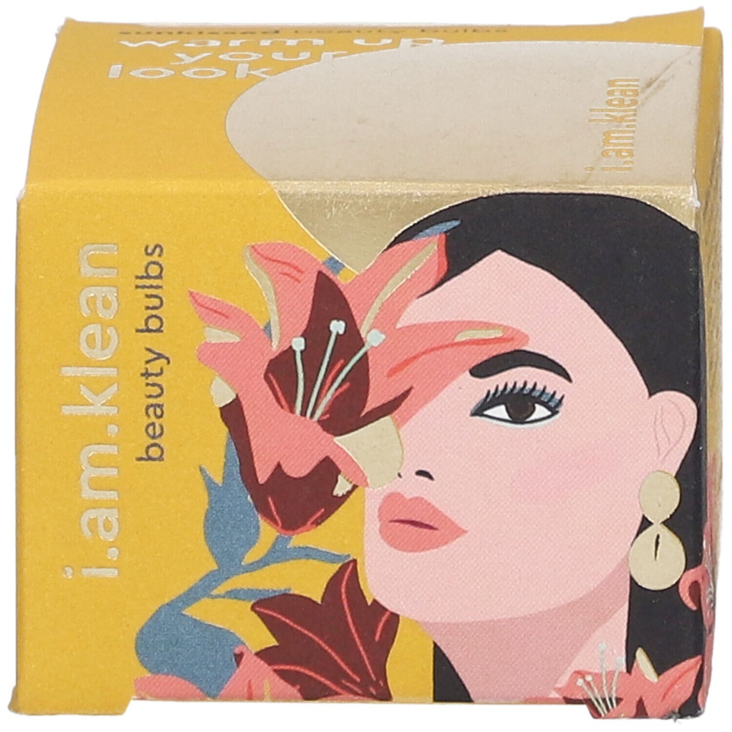 Gelbe Produktverpackung mit Illustration einer Frau und Lilien. Aufschrift: i.am.klean beauty bulbs.