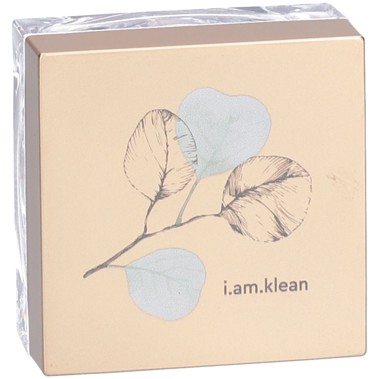 Quadratische Kosmetikdose in Folie verpackt. Goldener Deckel, transparenter Behälter. Auf dem Deckel: Blätter und "i.am.klean".