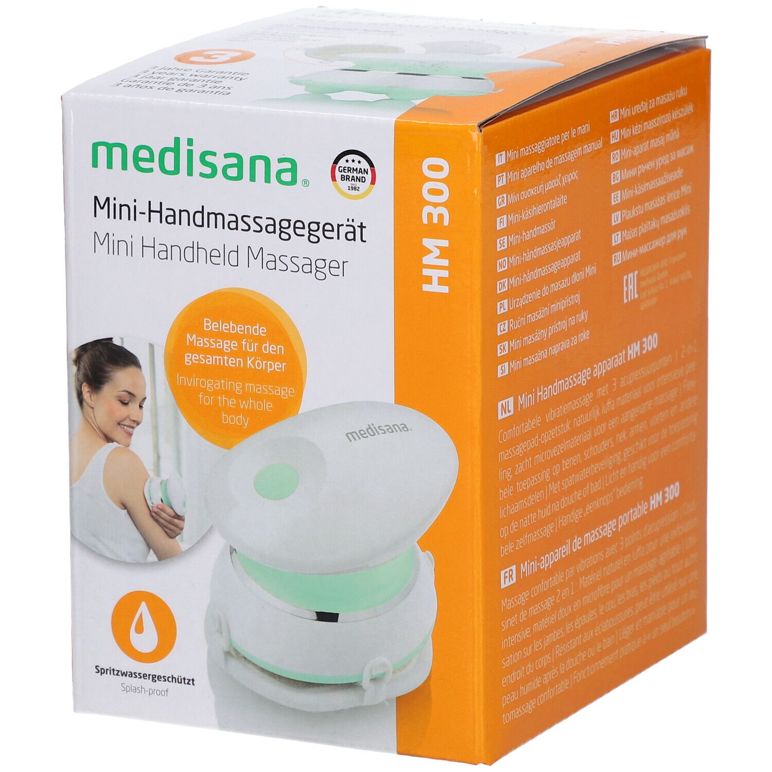 Emballage du mini masseur manuel Medisana HM 300. Appareil blanc avec anneau vert. Inscriptions : marque, nom du produit, certification.