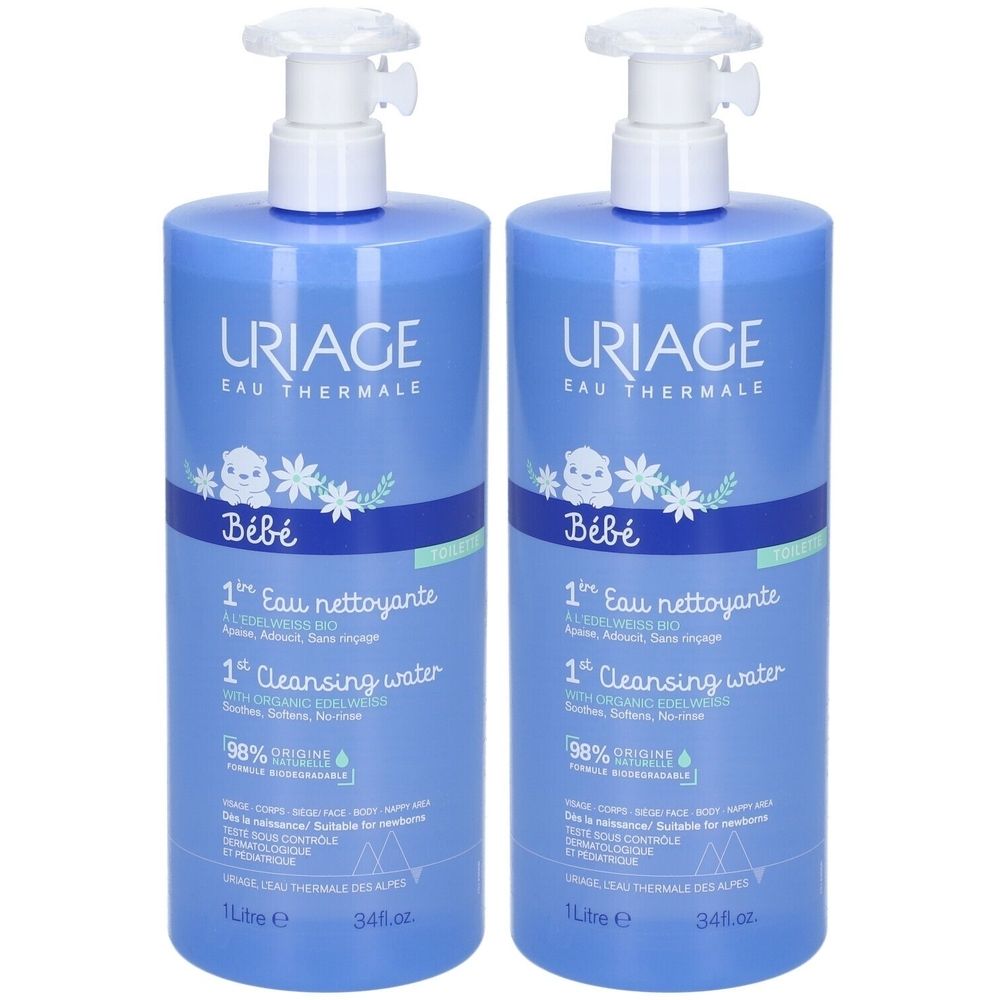 Zwei blaue Flaschen mit weißem Pumpkopf. Aufschrift: URIAGE, Bébé, 1st Eau nettoyante, 1st Cleansing water. 98% Origine.