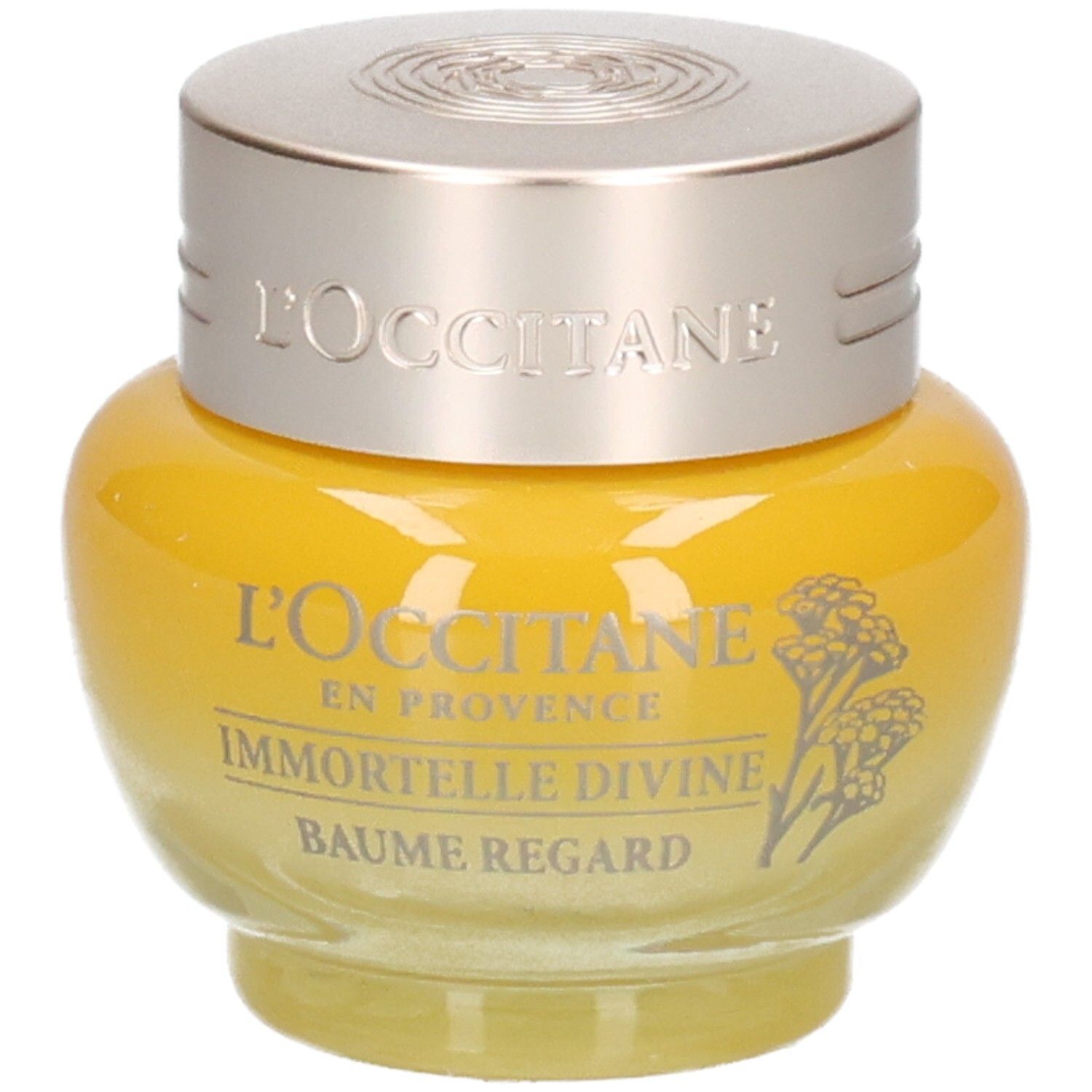 L'OCCITANE Immortelle Divine Augenbalsam in einem gelben Glasbehälter mit silbernem Deckel.