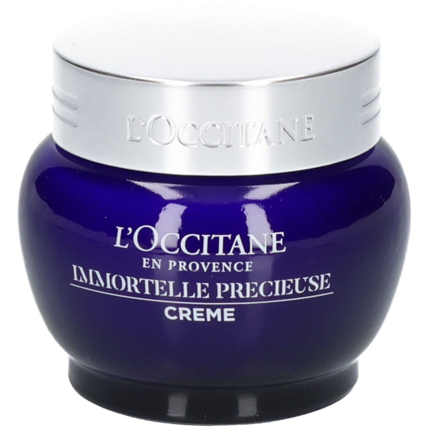 L'OCCITANE Immortelle Précieuse Creme in einem blauen Glasbehälter mit silbernem Deckel.