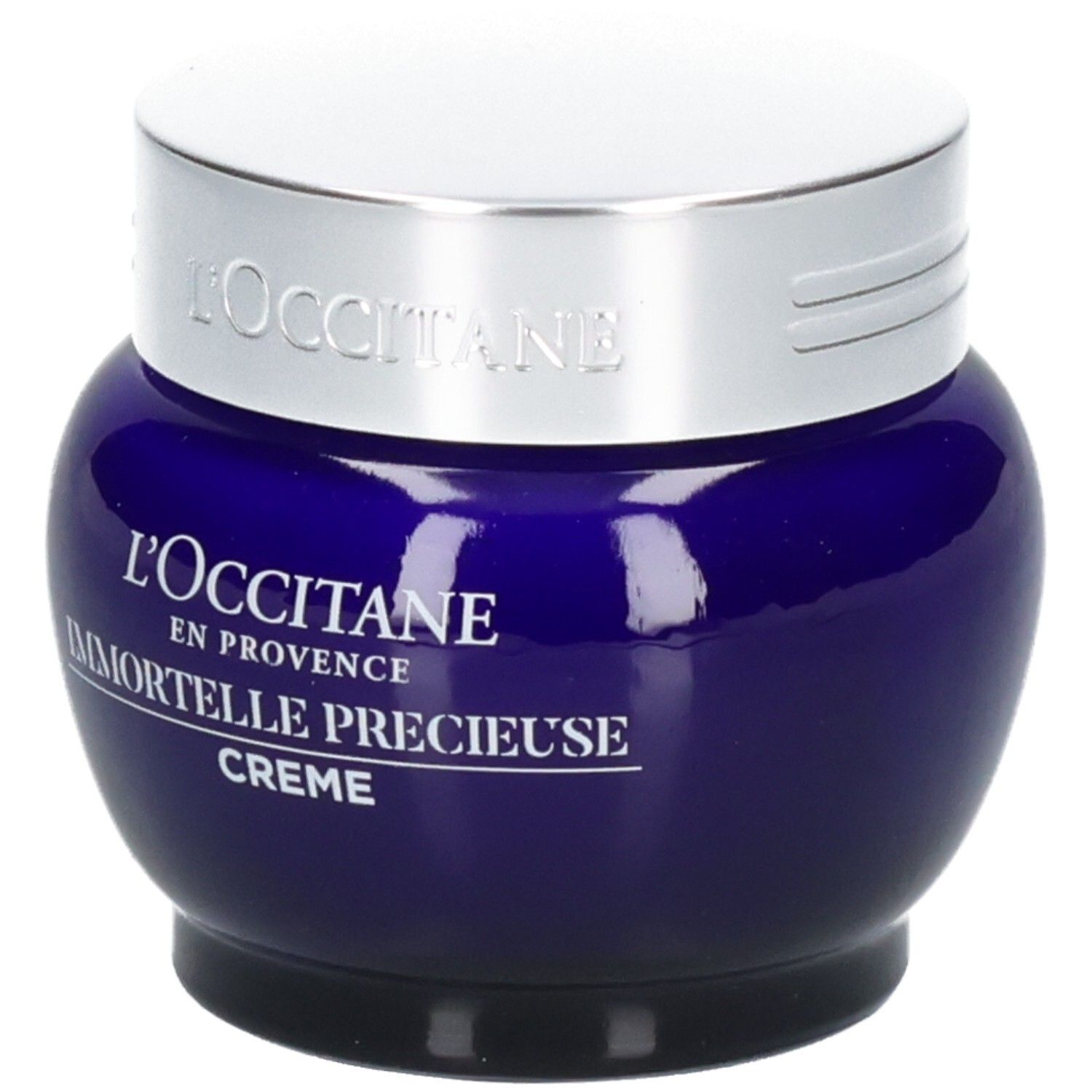 L'OCCITANE Immortelle Précieuse Creme in einem blauen Glasbehälter mit silbernem Deckel.
