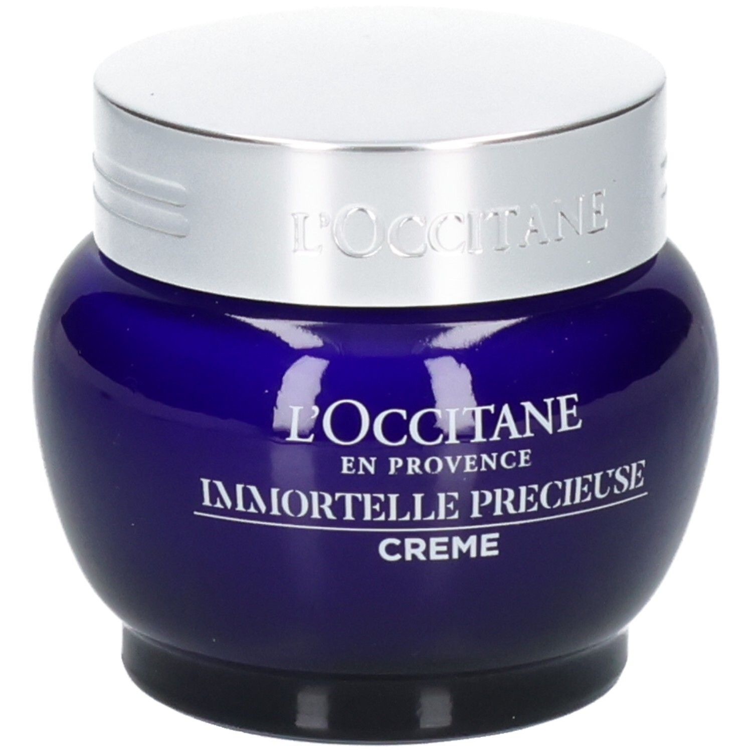 L'OCCITANE Immortelle Précieuse Creme in einem blauen Glasbehälter mit silbernem Deckel.