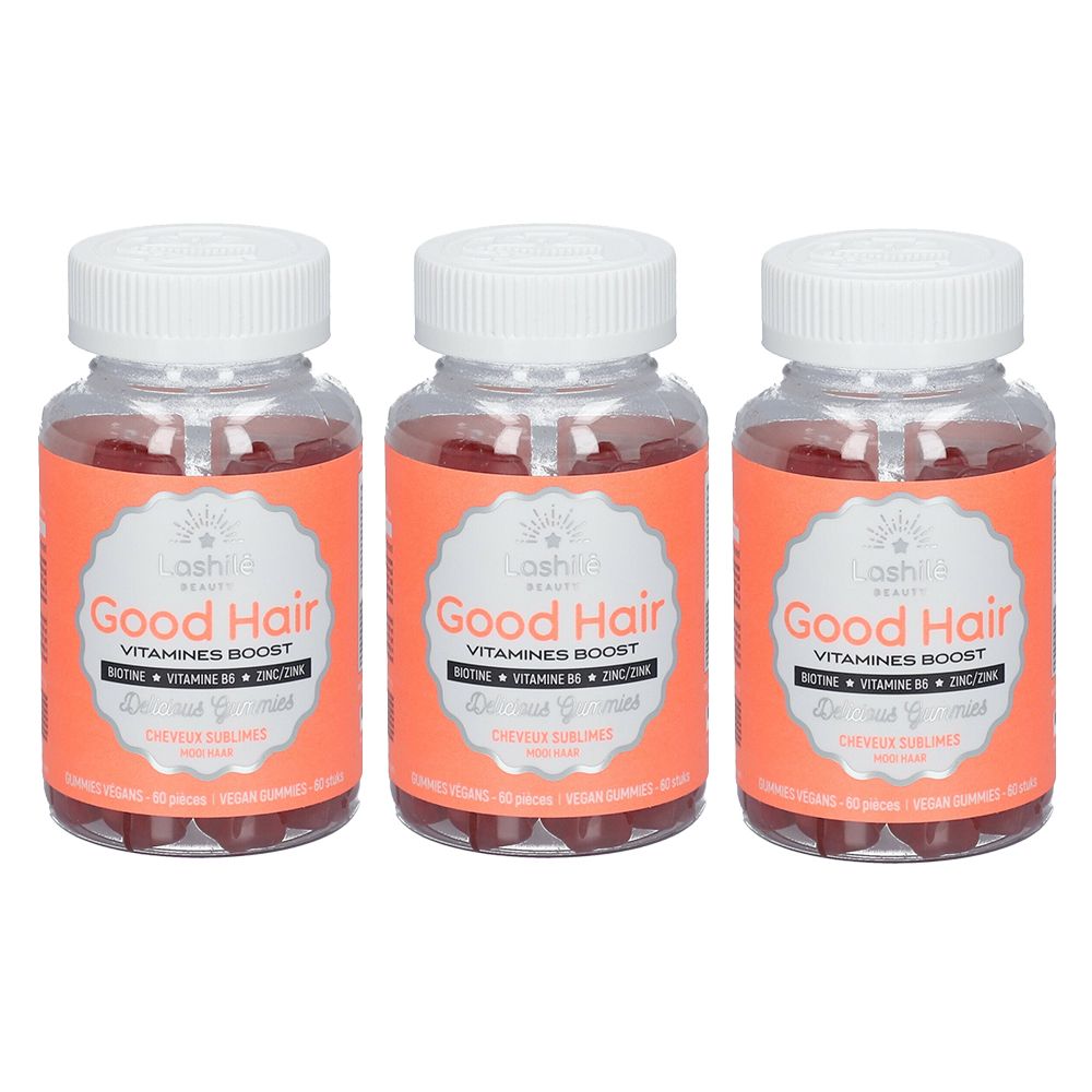Trois flacons de compléments alimentaires. Chaque flacon porte l'inscription "Good Hair" et "Vitamines Boost".