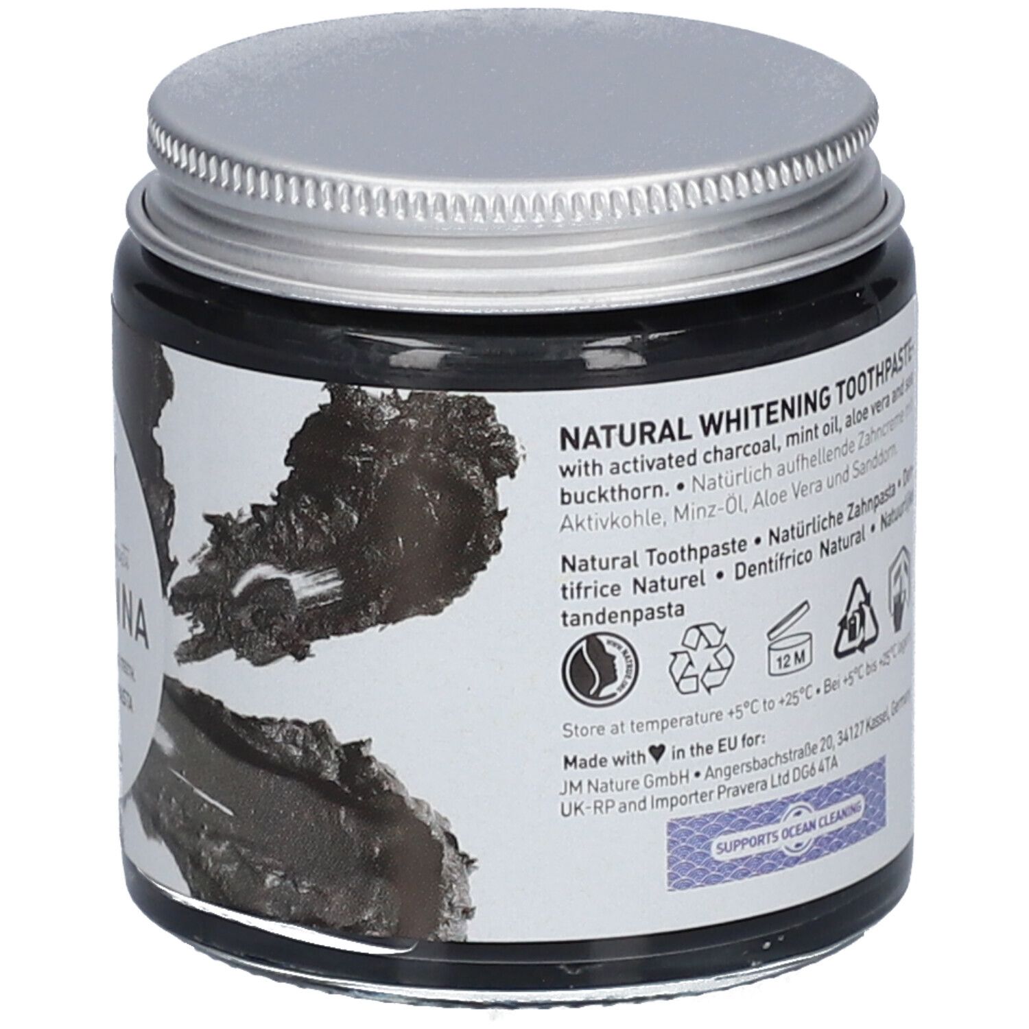 Rückseite des Zahnpasta-Glases. Text: NATURAL WHITENING TOOTHPASTE, Inhaltsstoffe, Recycling-Symbole, Adresse.