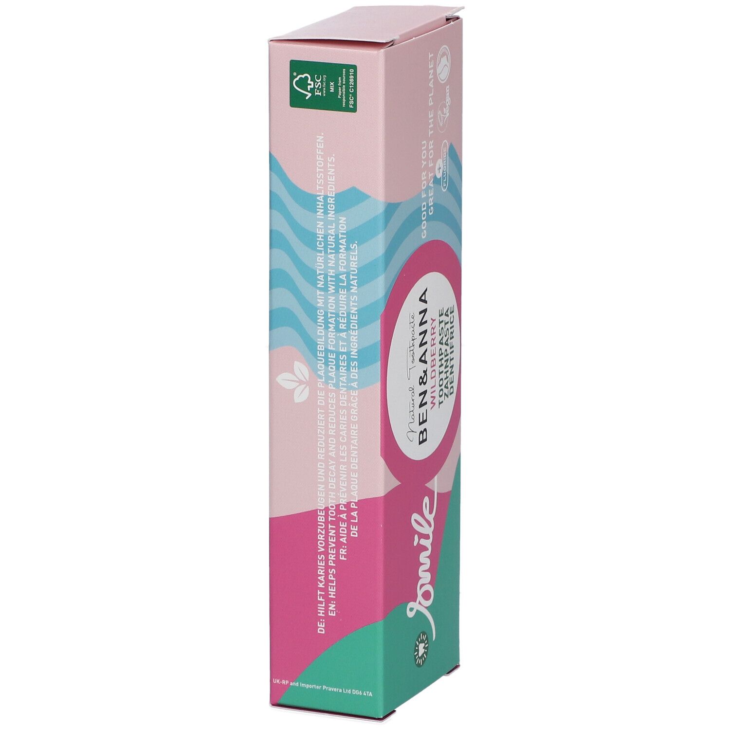 Zahnpasta-Verpackung, schräg. Rosa-weißes Design mit Produktnamen und Logo. Text in mehreren Sprachen.