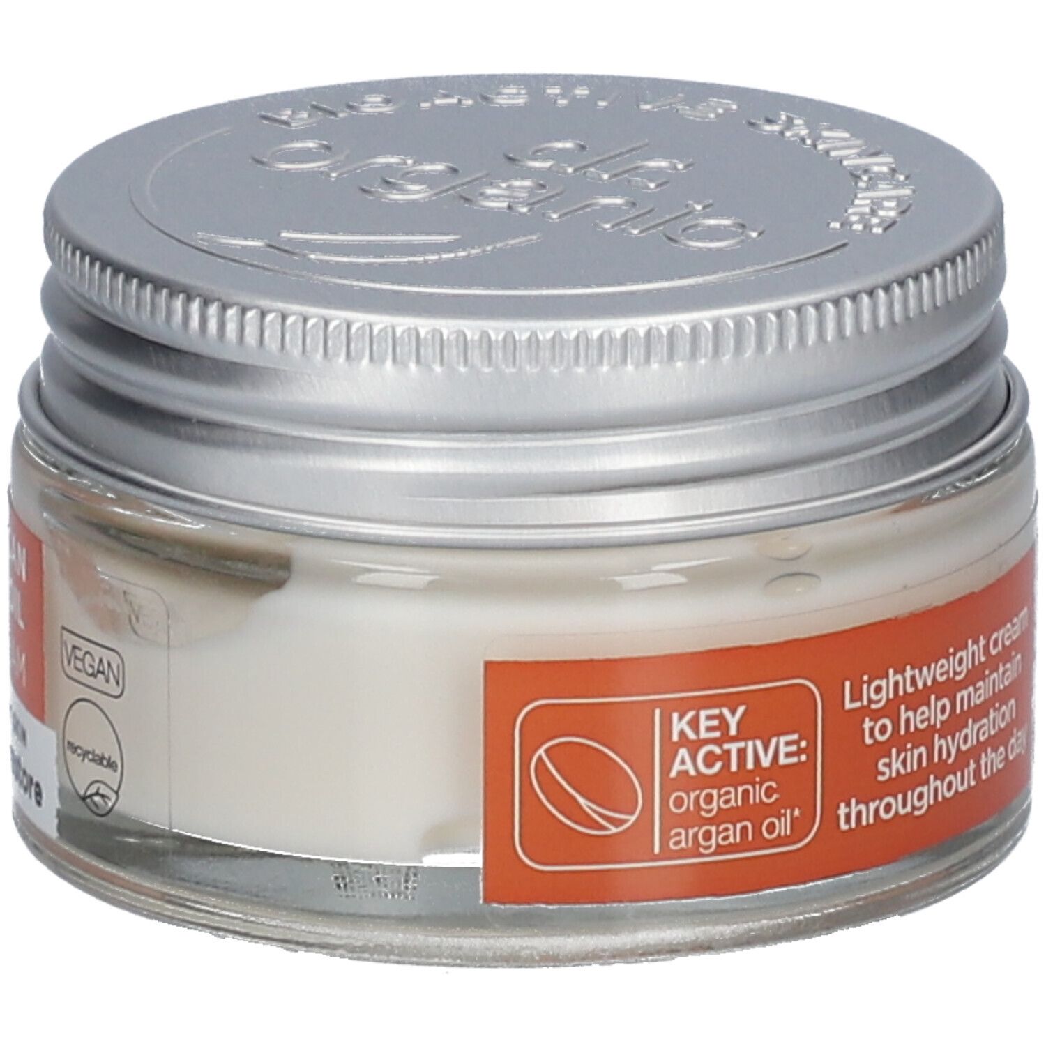 Creme in einem Glasbehälter mit silbernem Deckel. Auf dem Etikett steht "Key Active: organic argan oil" und "Vegan".