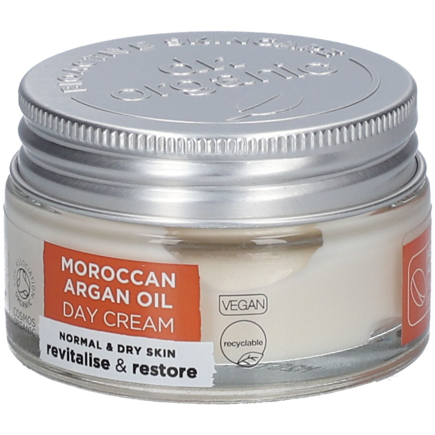 Creme in einem Glasbehälter mit silbernem Deckel. Auf dem Etikett steht "Moroccan Argan Oil Day Cream" und "Vegan".