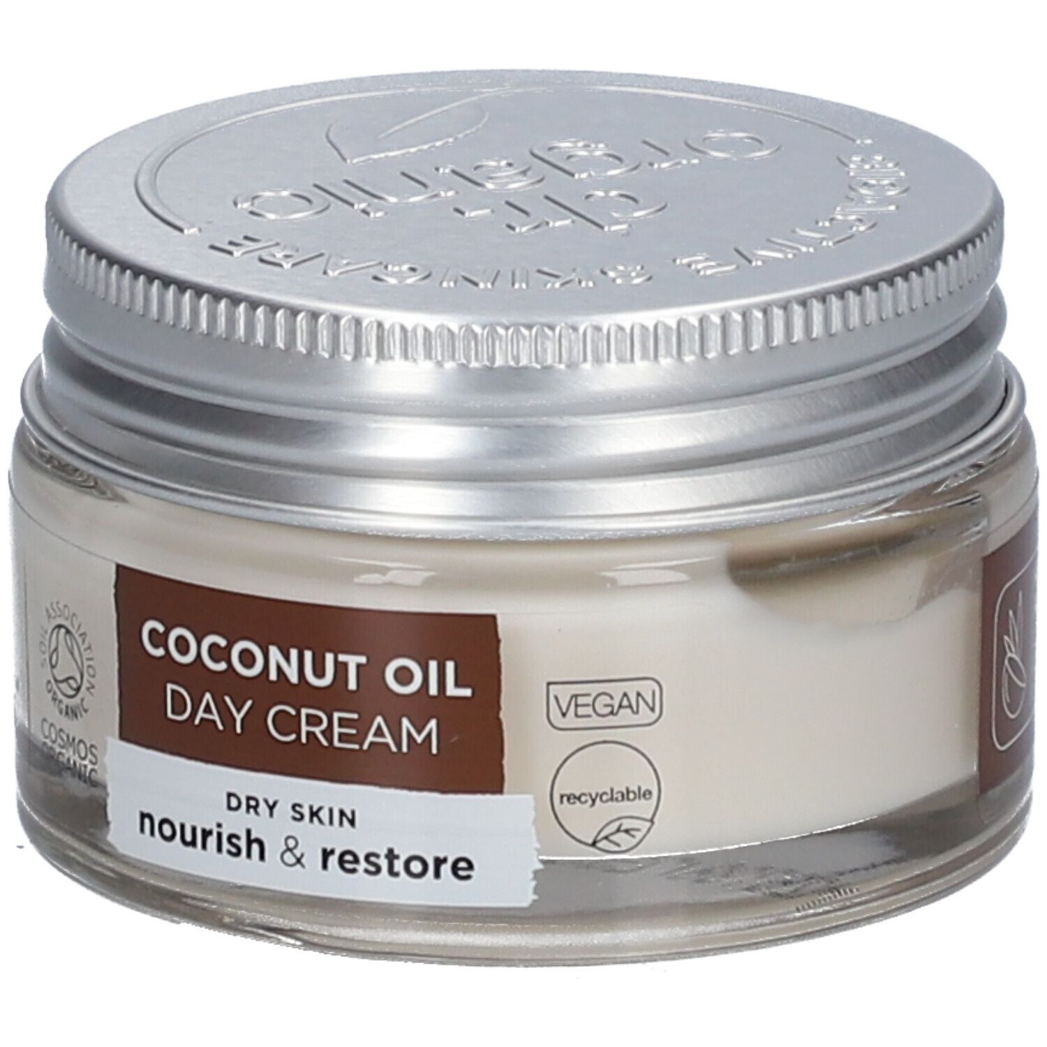 Crèmepot met deksel. Label: COCONUT OIL DAY CREAM, DRY SKIN, nourish & restore. Vegan-zegel.