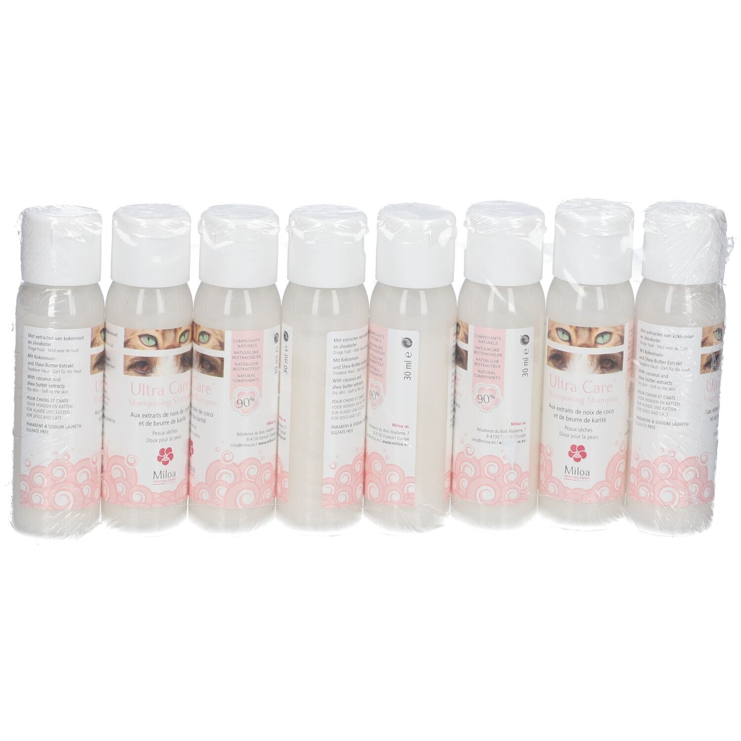 Acht Flaschen Miloa Ultra Care Shampoo, verpackt in Folie. Die Etiketten zeigen Produktnamen und Logo.