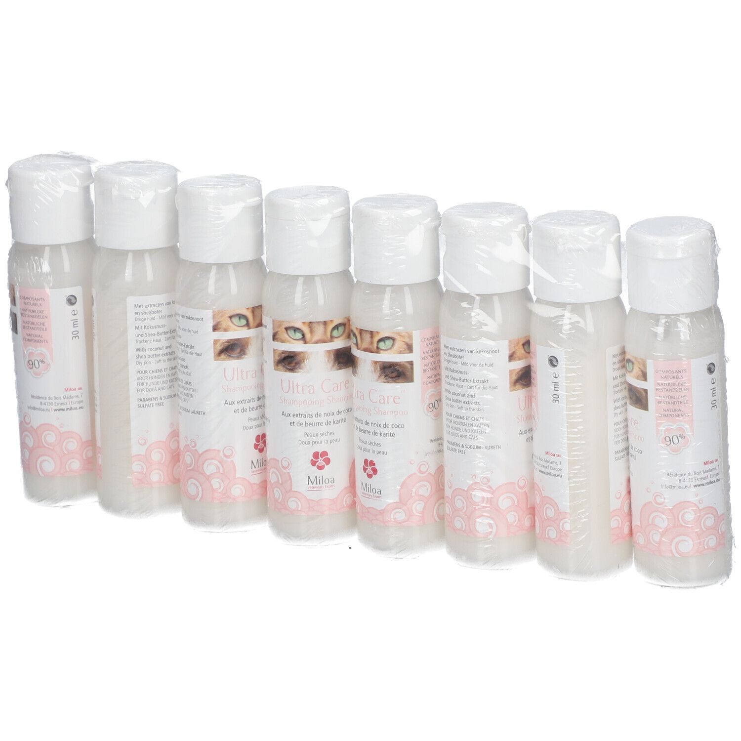 Acht Flaschen Miloa Ultra Care Shampoo, verpackt in Folie. Die Etiketten zeigen Produktnamen und Logo.
