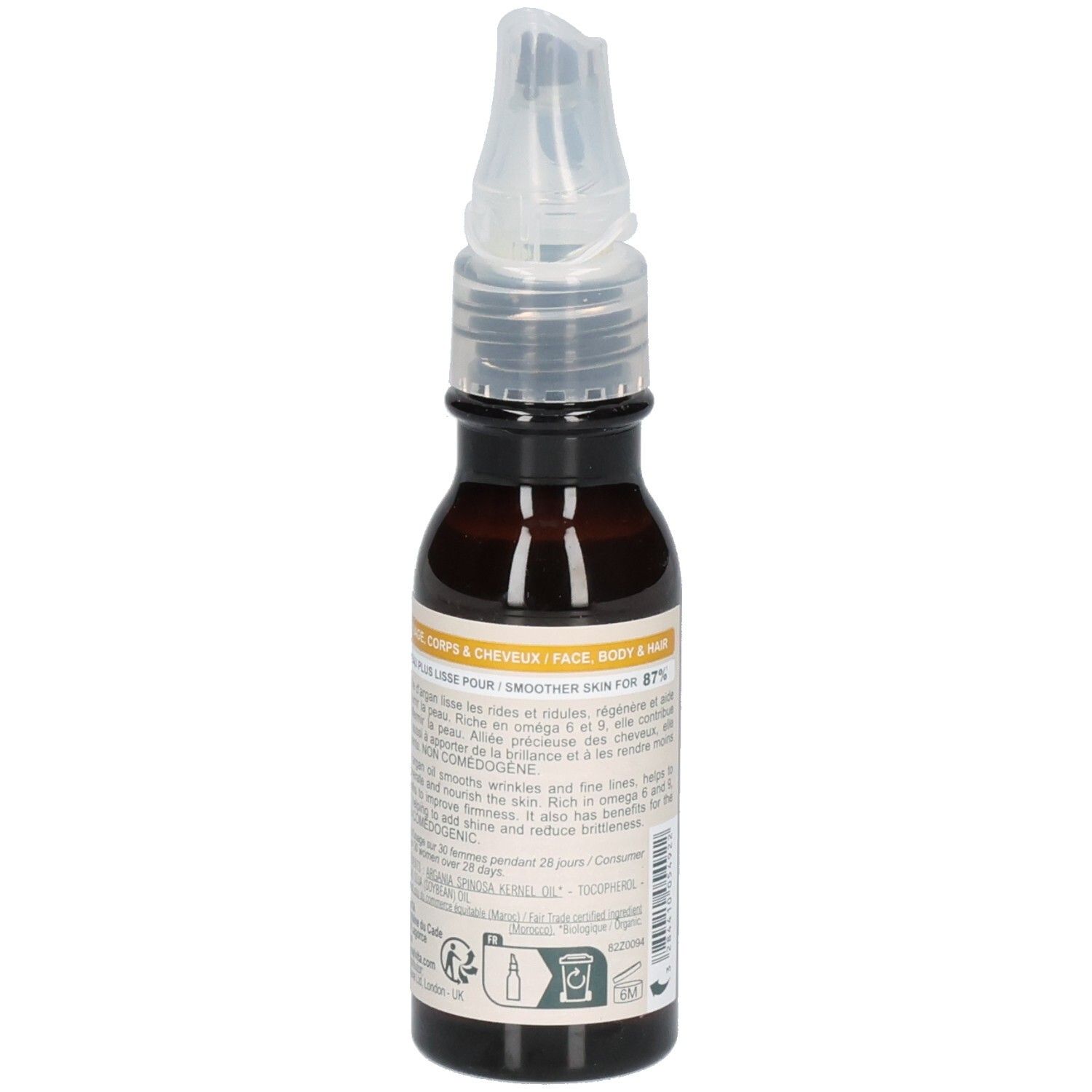 Melvita Arganöl Flasche mit Applikator, umgeben von Arganfrüchten. "100% rein, kaltgepresst".