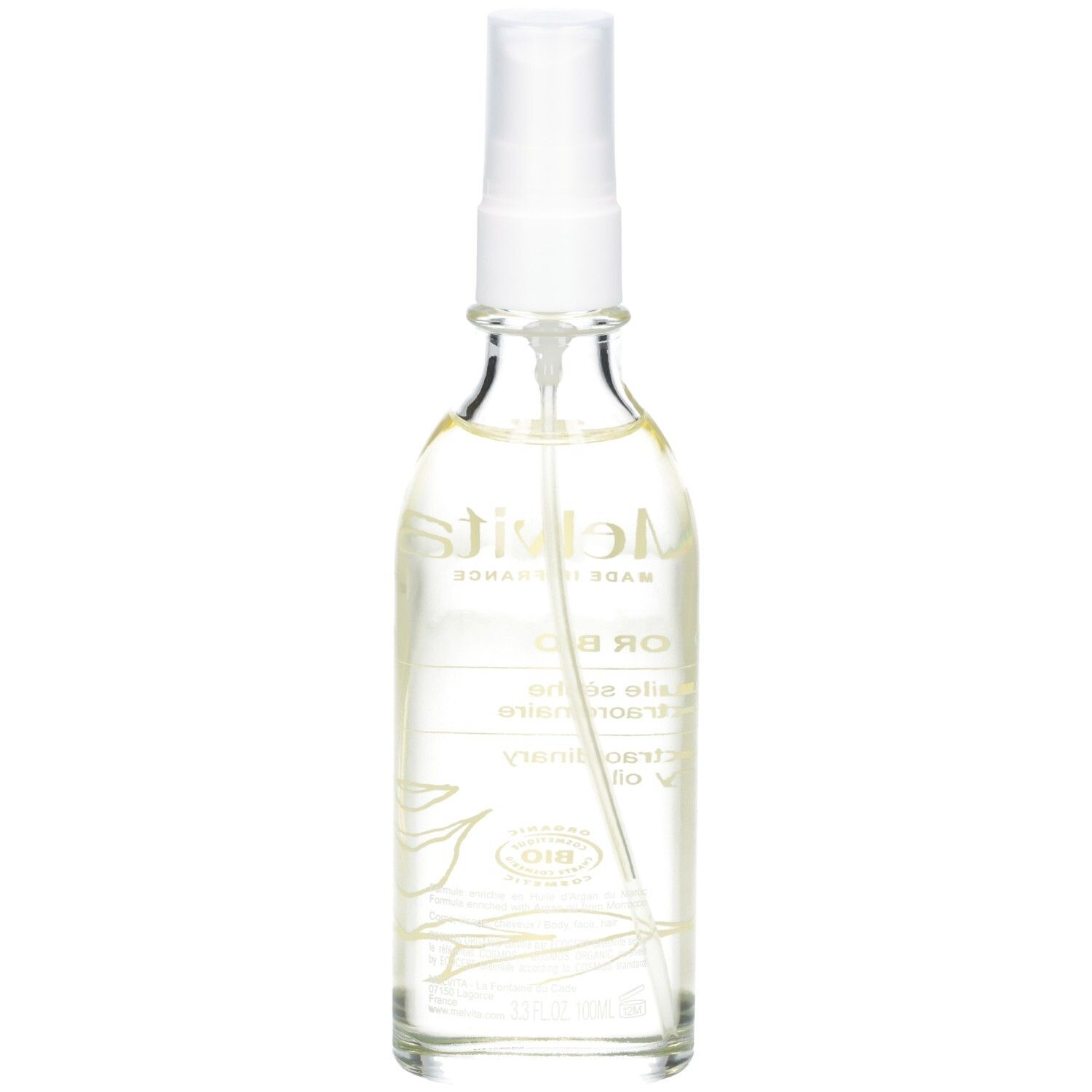 Glasflasche mit Sprühkopf. Enthält goldfarbenes Öl. Etikett mit Text und Logo.