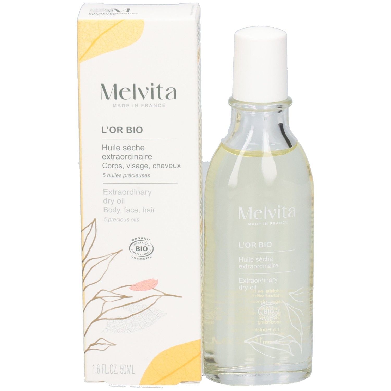 Melvita Flasche mit hellem Öl und Schachtel mit Blattmotiv.