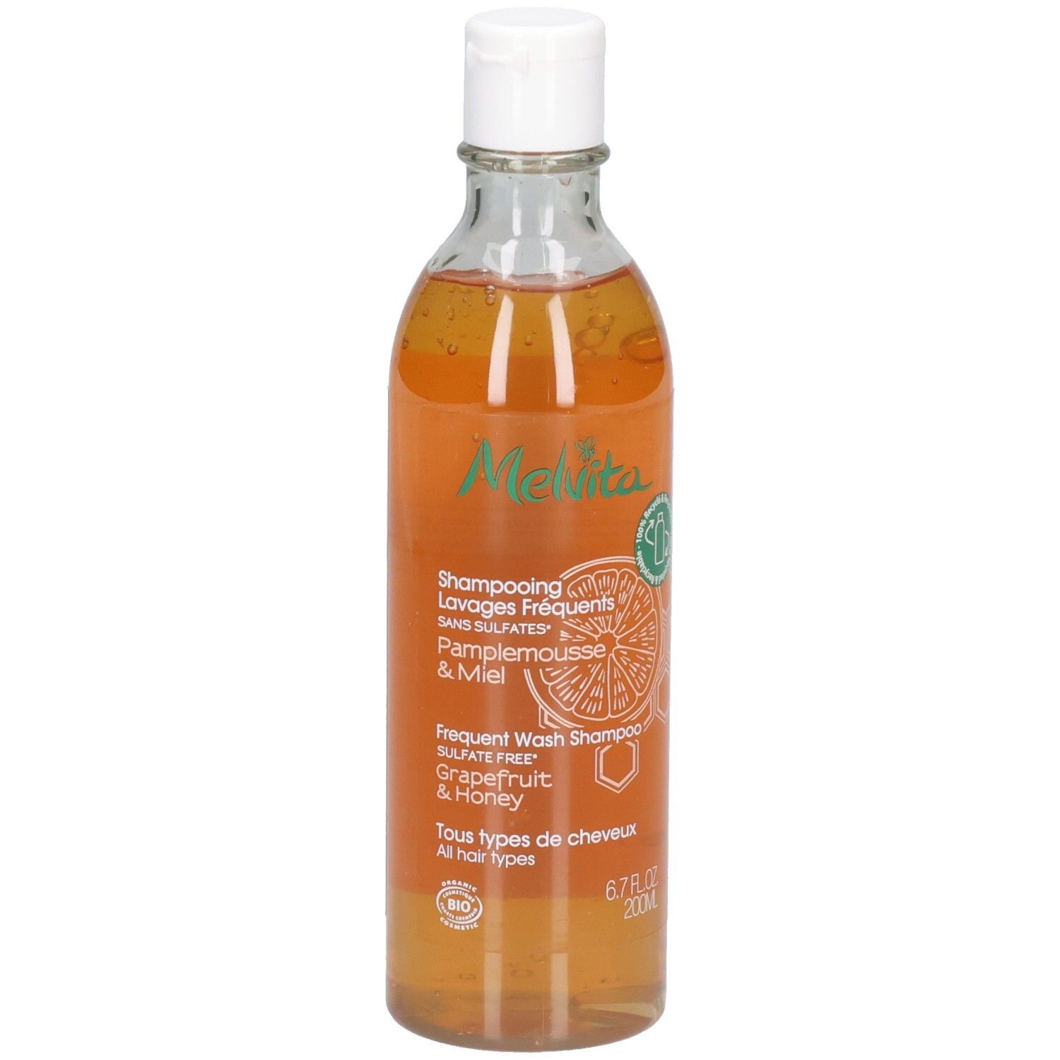 Melvita Shampoo mit Grapefruit & Honig, 200ml. Transparente Flasche mit weißem Klappdeckel.