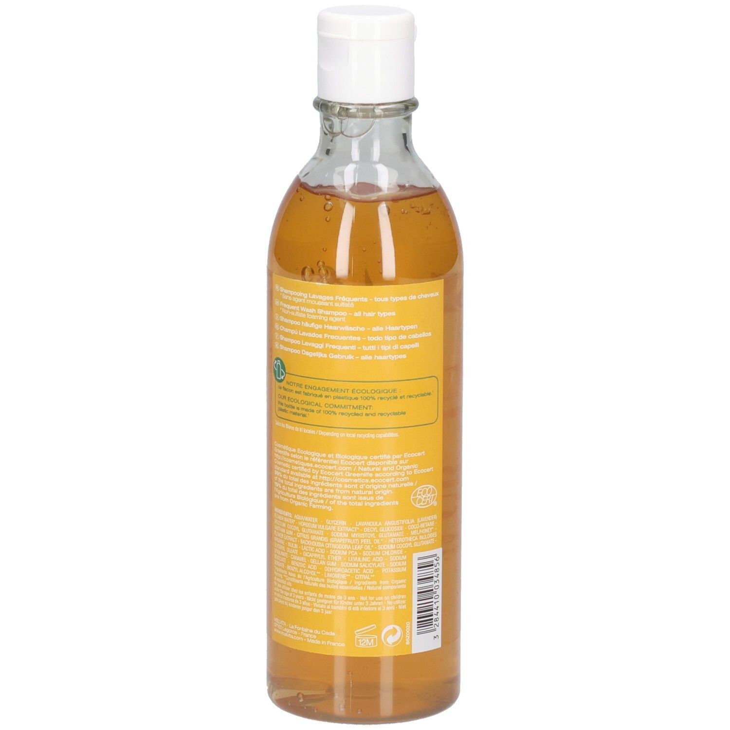 Klare Glasflasche mit weißem Verschluss, gefüllt mit gelblicher Flüssigkeit. Gelbes Etikett mit Text und Barcode.