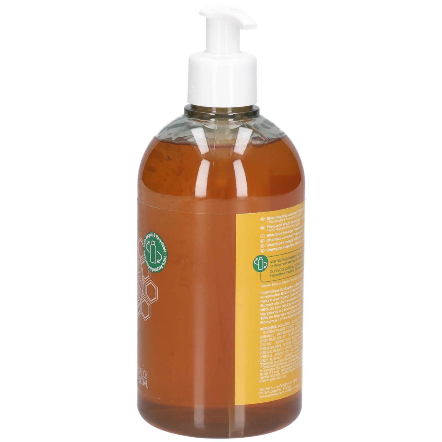 Braune Flüssigseife in durchsichtiger Pumpspenderflasche mit gelbem Etikett und Bienenwaben-Symbol.