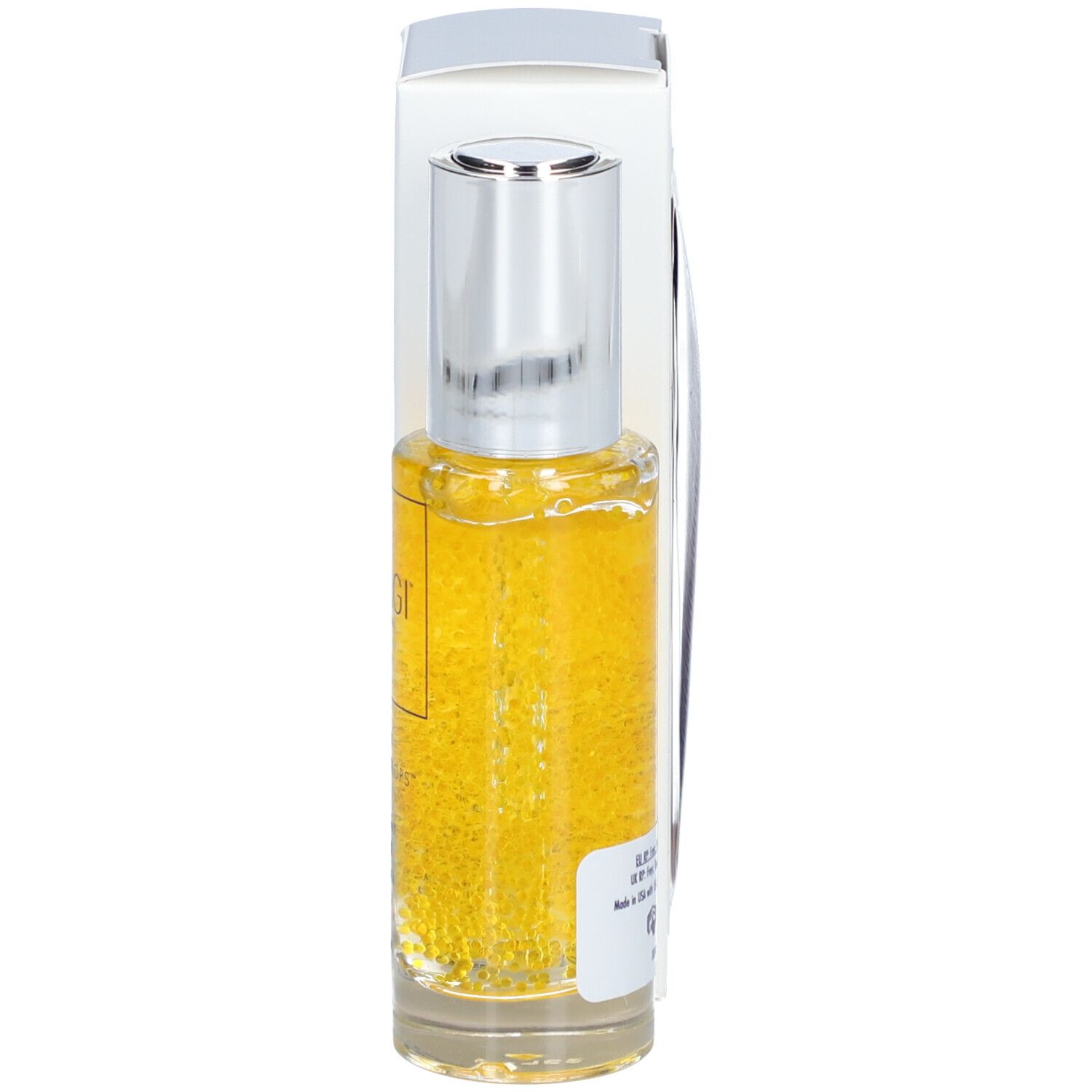 Flacon de sérum avec bouchon argenté et boîte. Liquide jaune avec billes. Inscription : OBAGI MEDICAL.